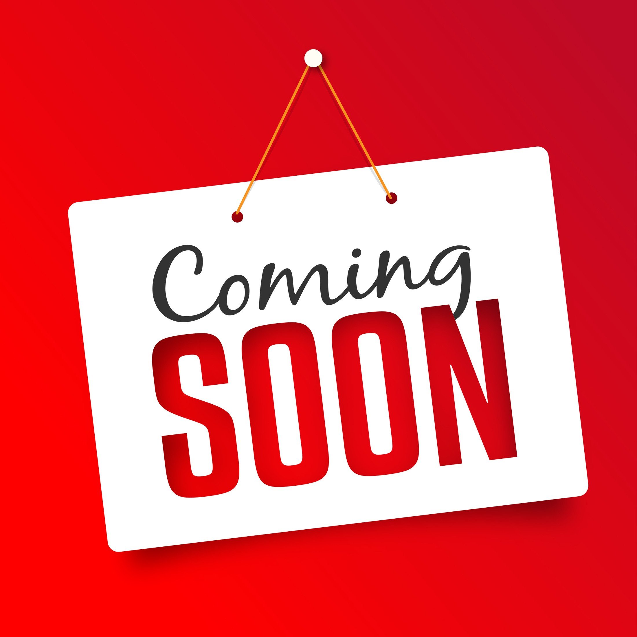 A white sign hanging on a red background that says "Coming SOON" with "Coming" in black cursive and "SOON" in large red capital letters.