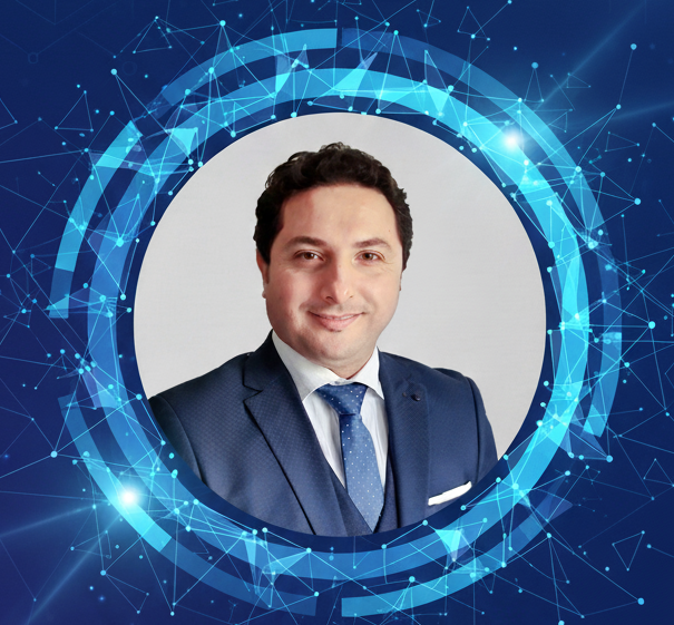 Professional portrait of a man in a blue suit with a white shirt and blue tie, surrounded by a digital blue and white futuristic network graphic.