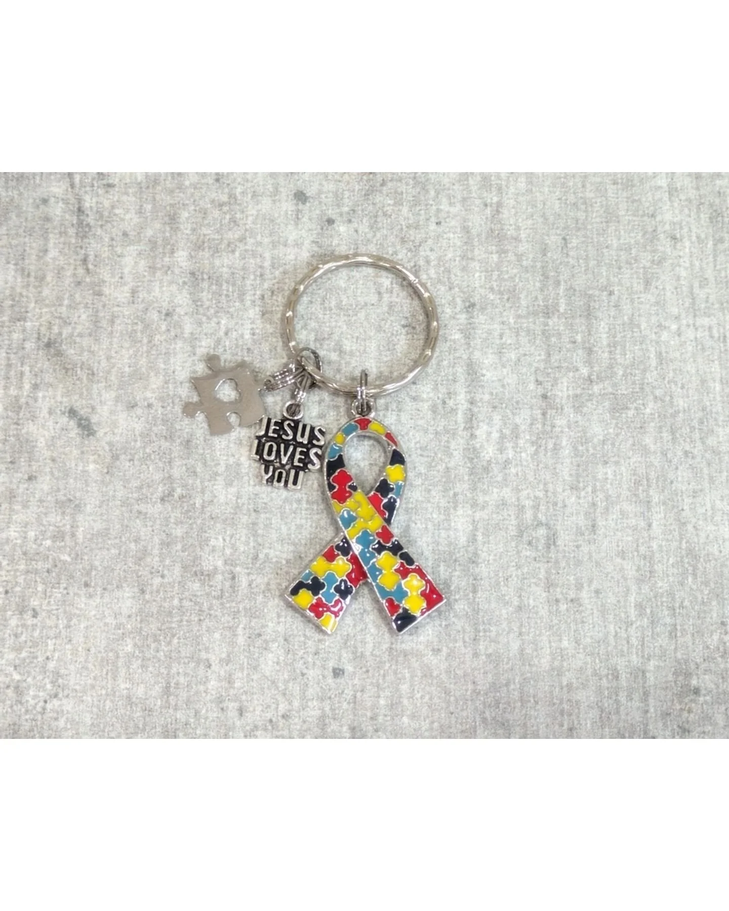 Celebrate individuality and raise awareness with our Autism Awareness Keychain. This beautifully crafted accessory features either a silver infinity symbol or a colorful puzzle piece ribbon that says (Jesus loves me), making it a perfect statement pi