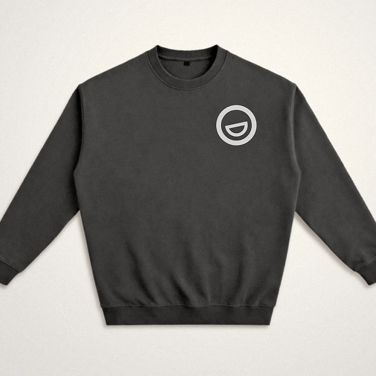 Charcoal grey sweatshirt with a light grey MGD smile logo on the upper left chest.
