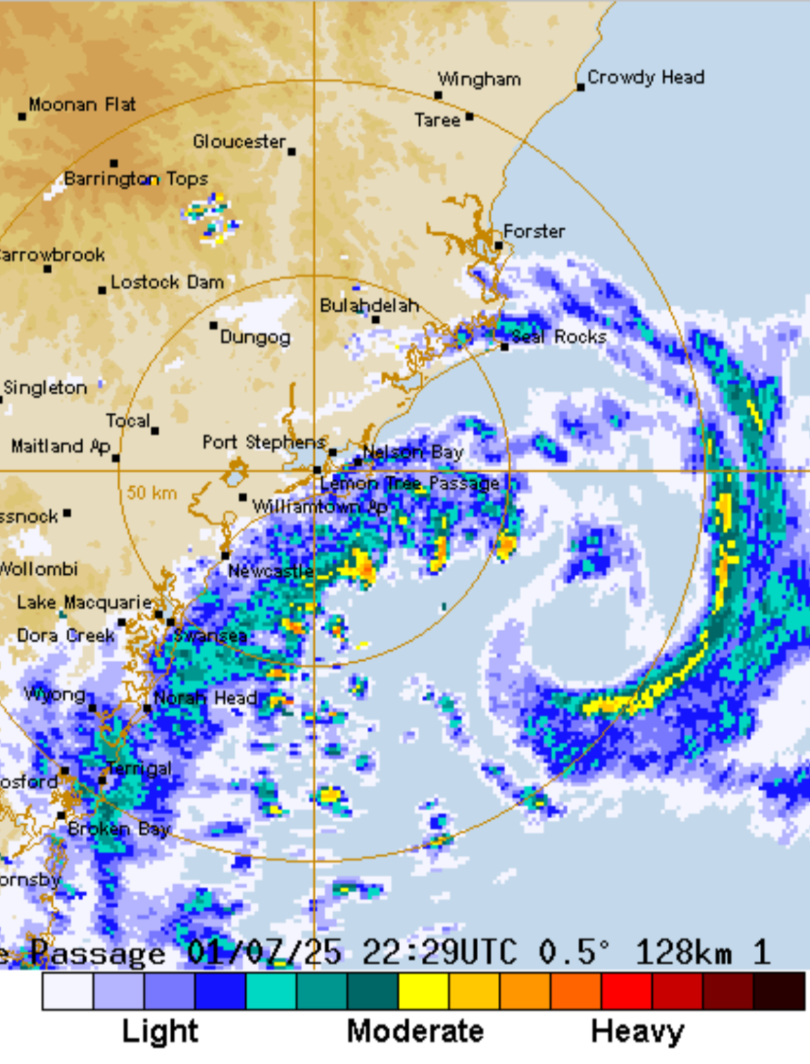 Radar weather map showing a tropical cyclone approaching northeastern Queensland, Australia, with heavy rain and storm activity.