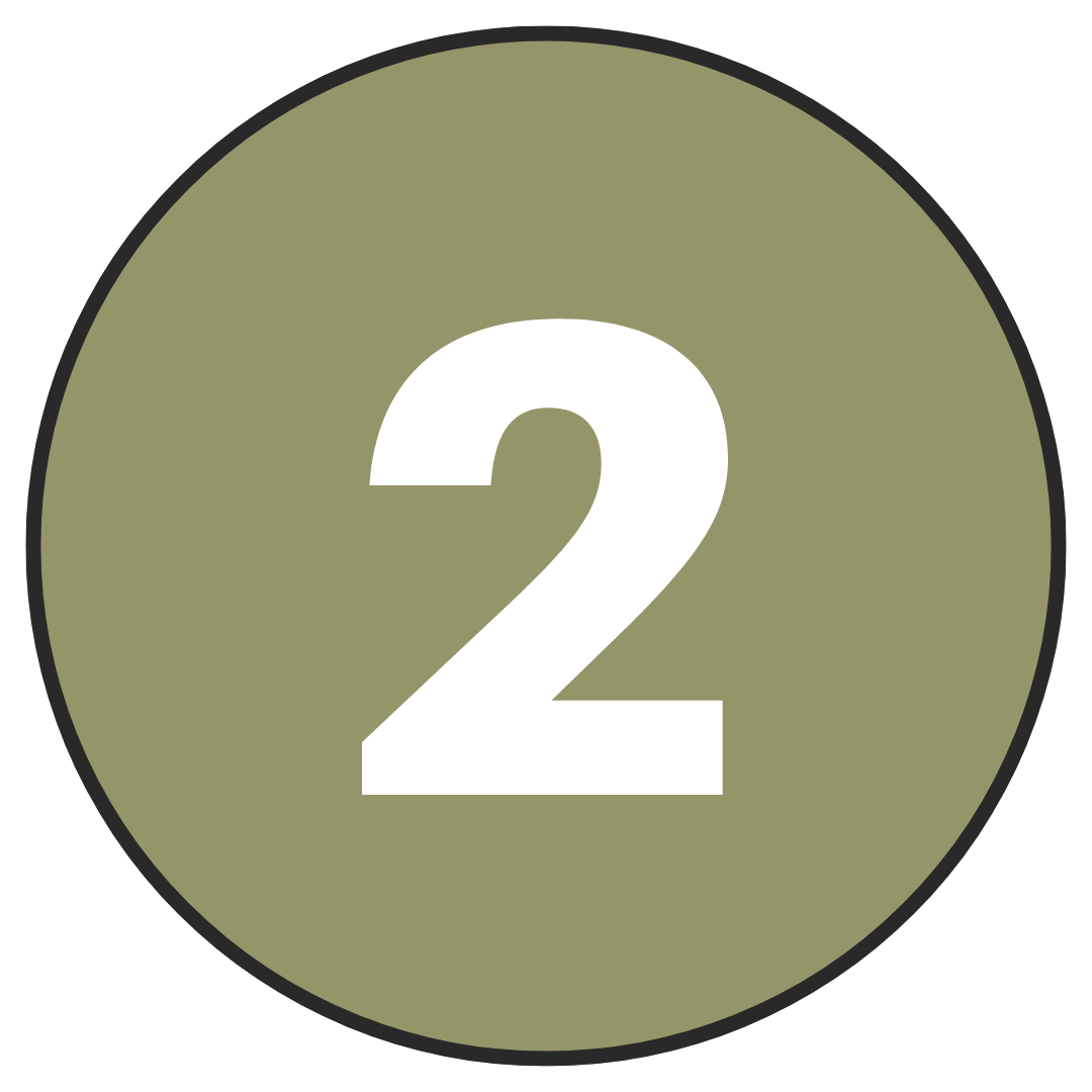 A circular sign with a green background and white number two in the center.
