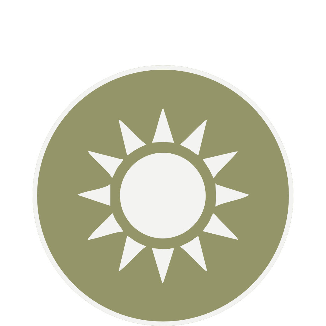 A circular emblem with a green background and a sun symbol with white rays in the center.