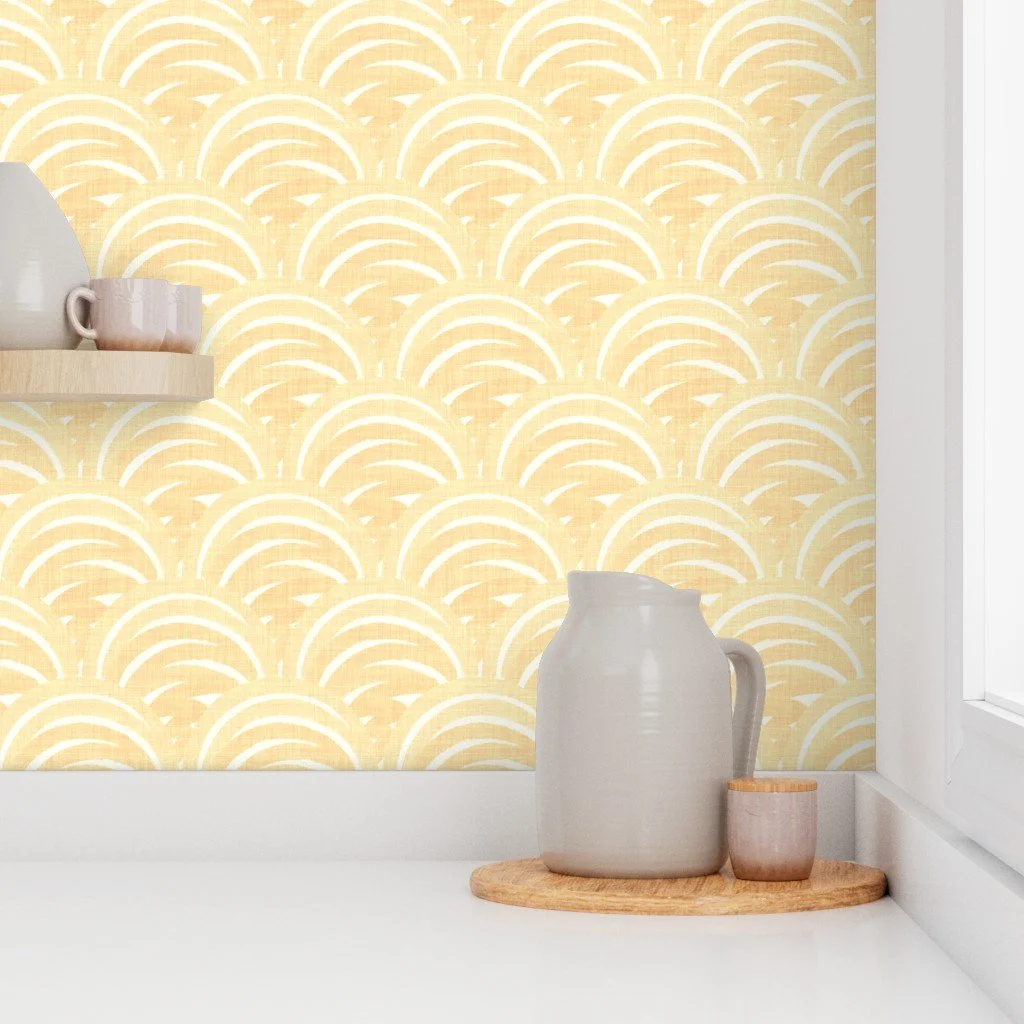 Boho Coastal Scallops by Aitch Jay Designs — yellow scallop‑wave wallpaper shown in a kitchen setting, creating a bright, modern coastal look with soft repeating arches.