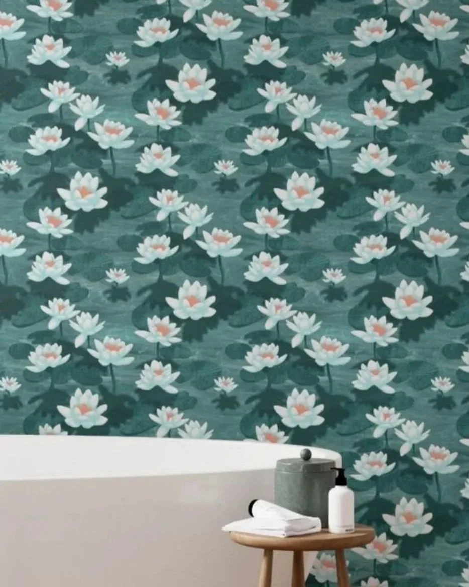 Lotus Blossom Drift by Aitch Jay Designs — a teal lotus‑flower pattern design shown on bathroom wallpaper, showcasing the tranquil, water‑garden‑inspired design.