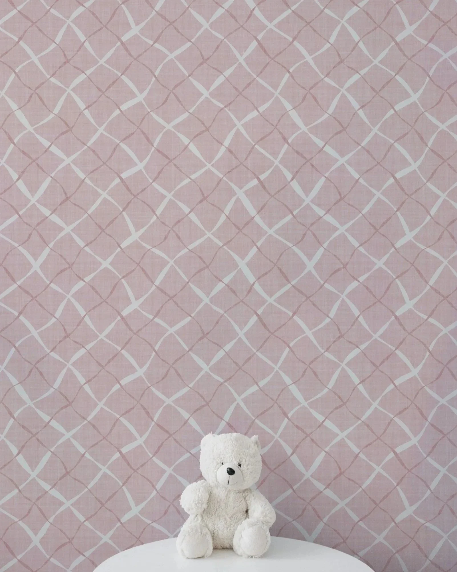 Ribbon Lattice by Aitch Jay Designs — pink curved‑line lattice wallpaper with a soft geometric rhythm, ideal for modern nursery décor and pastel interior styling.