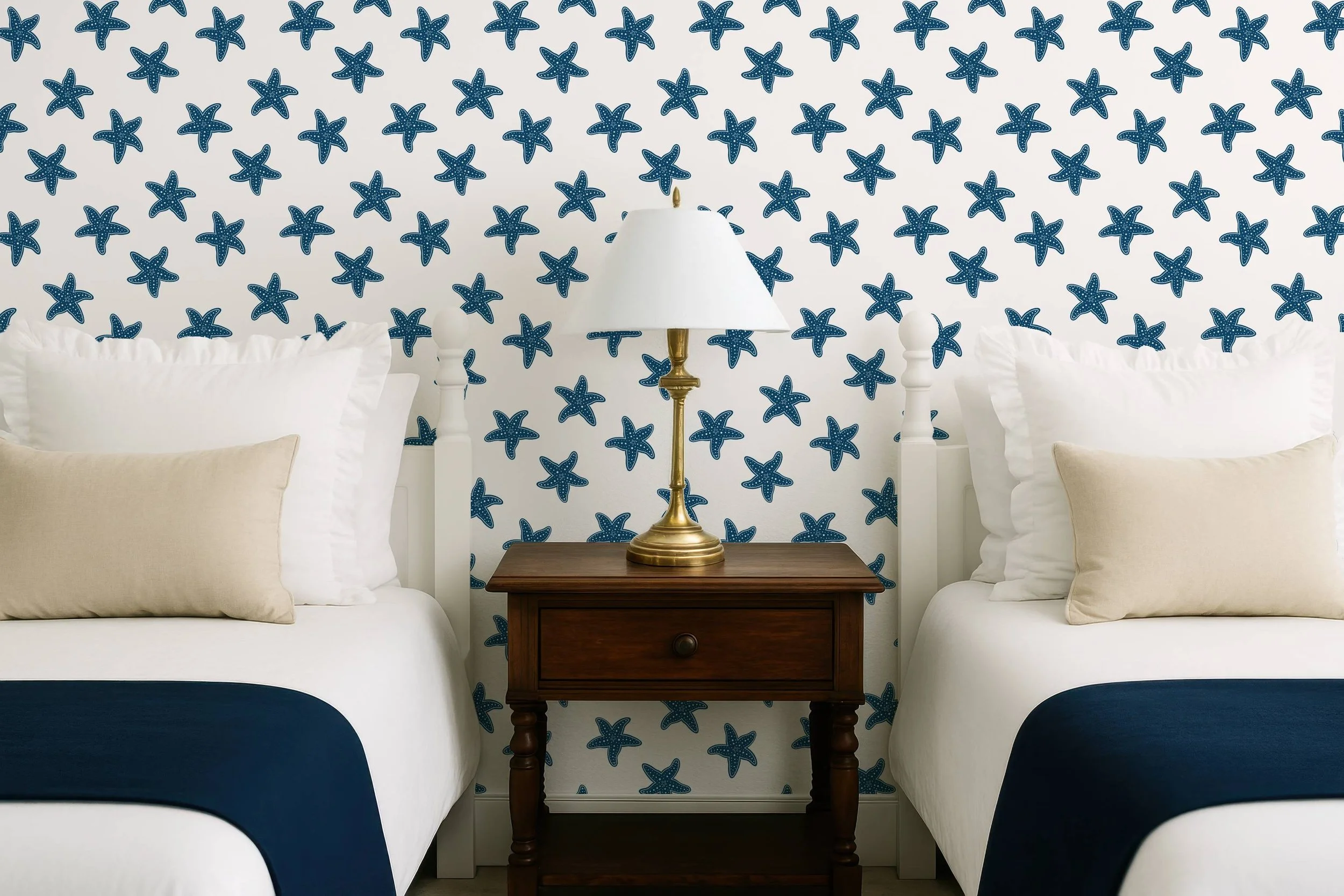 A fresh coastal starfish pattern in blue on white, shown as wallpaper to highlight its clean nautical style and suitability for modern beach‑inspired décor