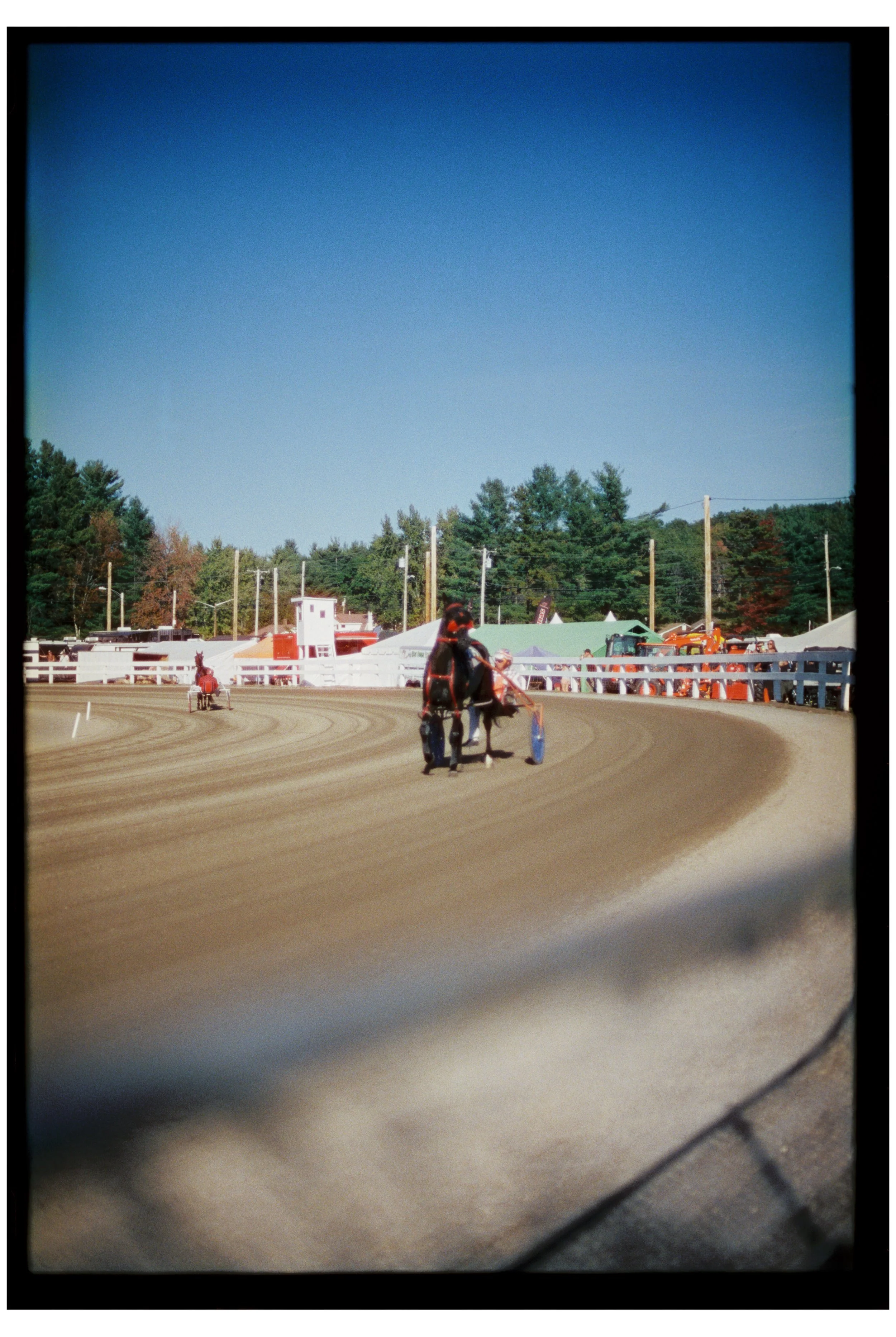 Fryeburg Fair with Becca, Ty, and Zac. Fryeburg, Maine. October 2025. Nikon F3. CineStill 400D.