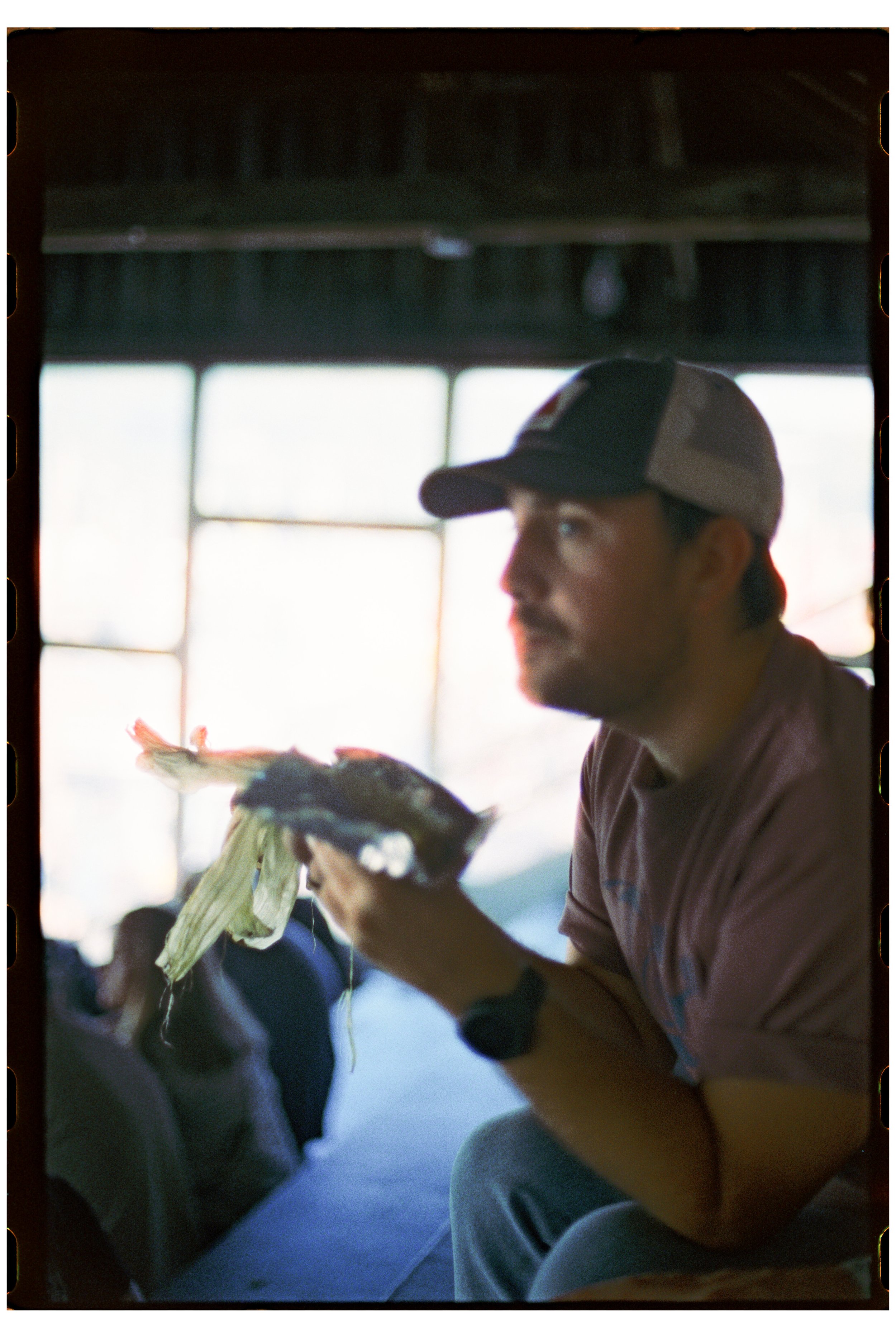 Fryeburg Fair. Ty with roasted corn. Fryeburg, Maine. October 2025. Nikon F3. CineStill 400D.