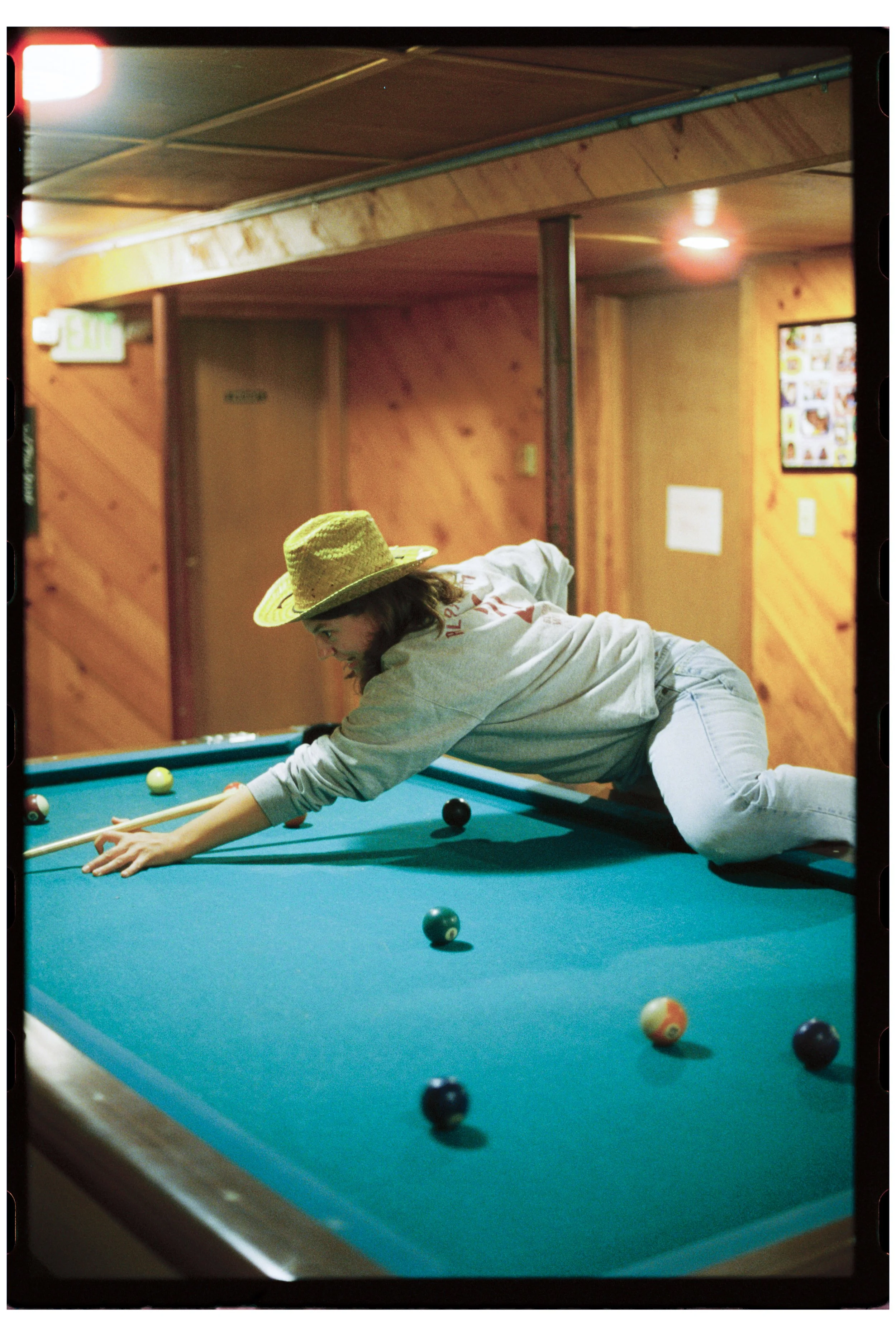 Becca playing pool at Camp Calumet. Freedom, NH. October 2025.