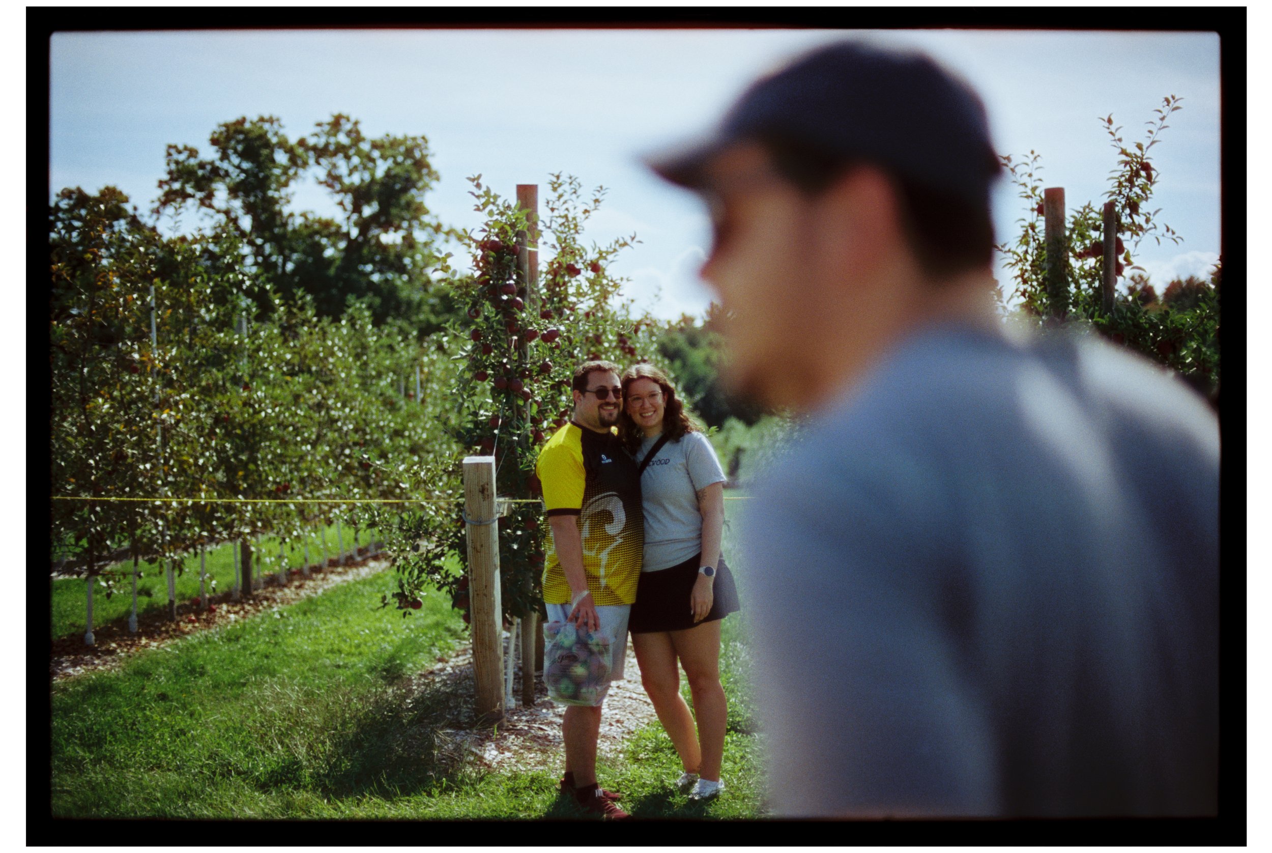 Apple picking. October 2025. New Hampshire. Nikon F3. CineStill 400D.