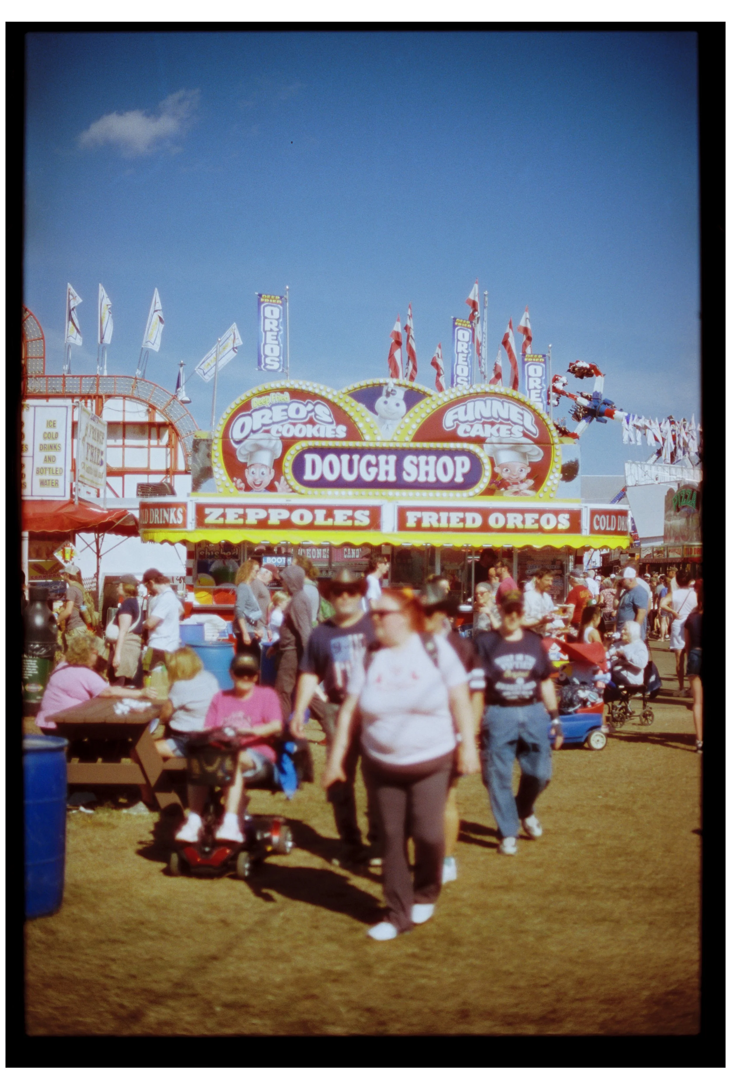 Fryeburg Fair with Becca, Ty, and Zac. Fryeburg, Maine. October 2025. Nikon F3. CineStill 400D.