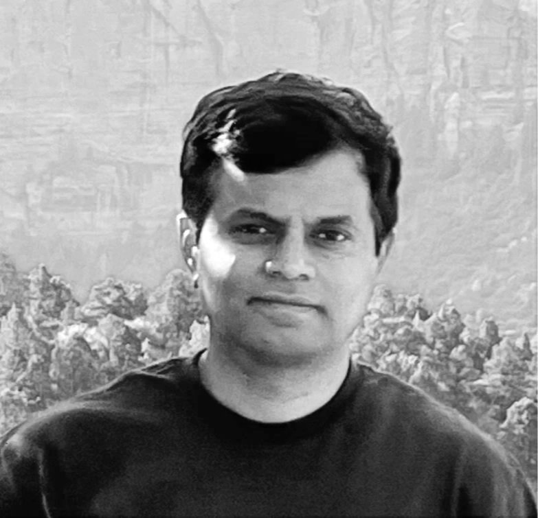 Headshot of a man with a scenic background