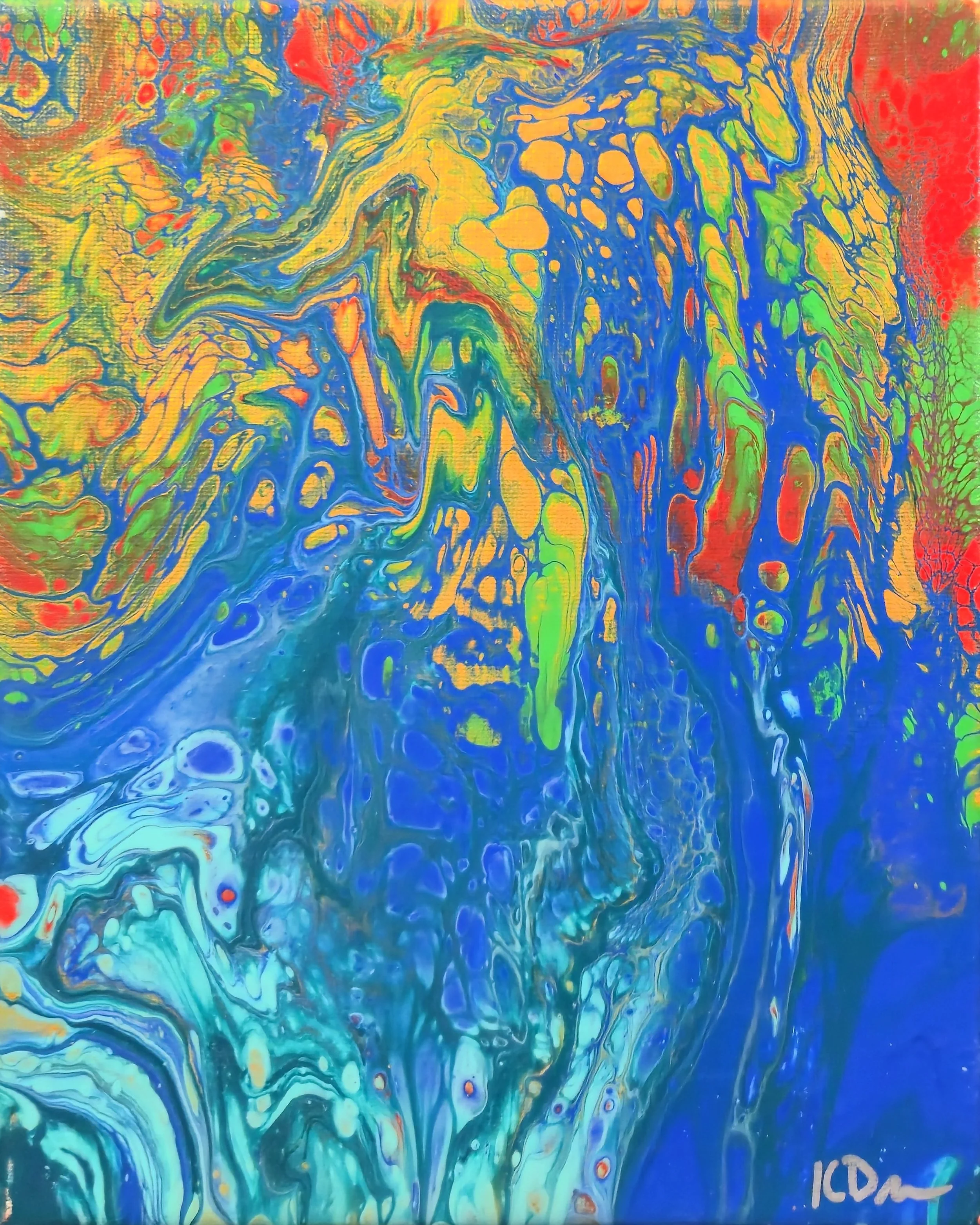 Abstract acrylic pour painting with vivid swirls of blue, green, yellow, red, and orange colors.