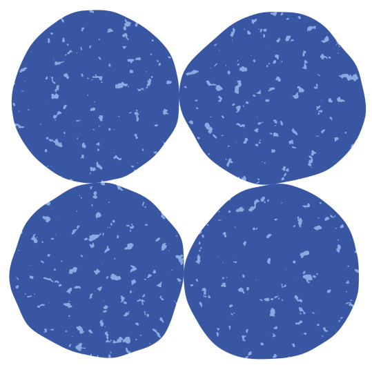 Four blue tablets or pills with speckled texture arranged in a square pattern.