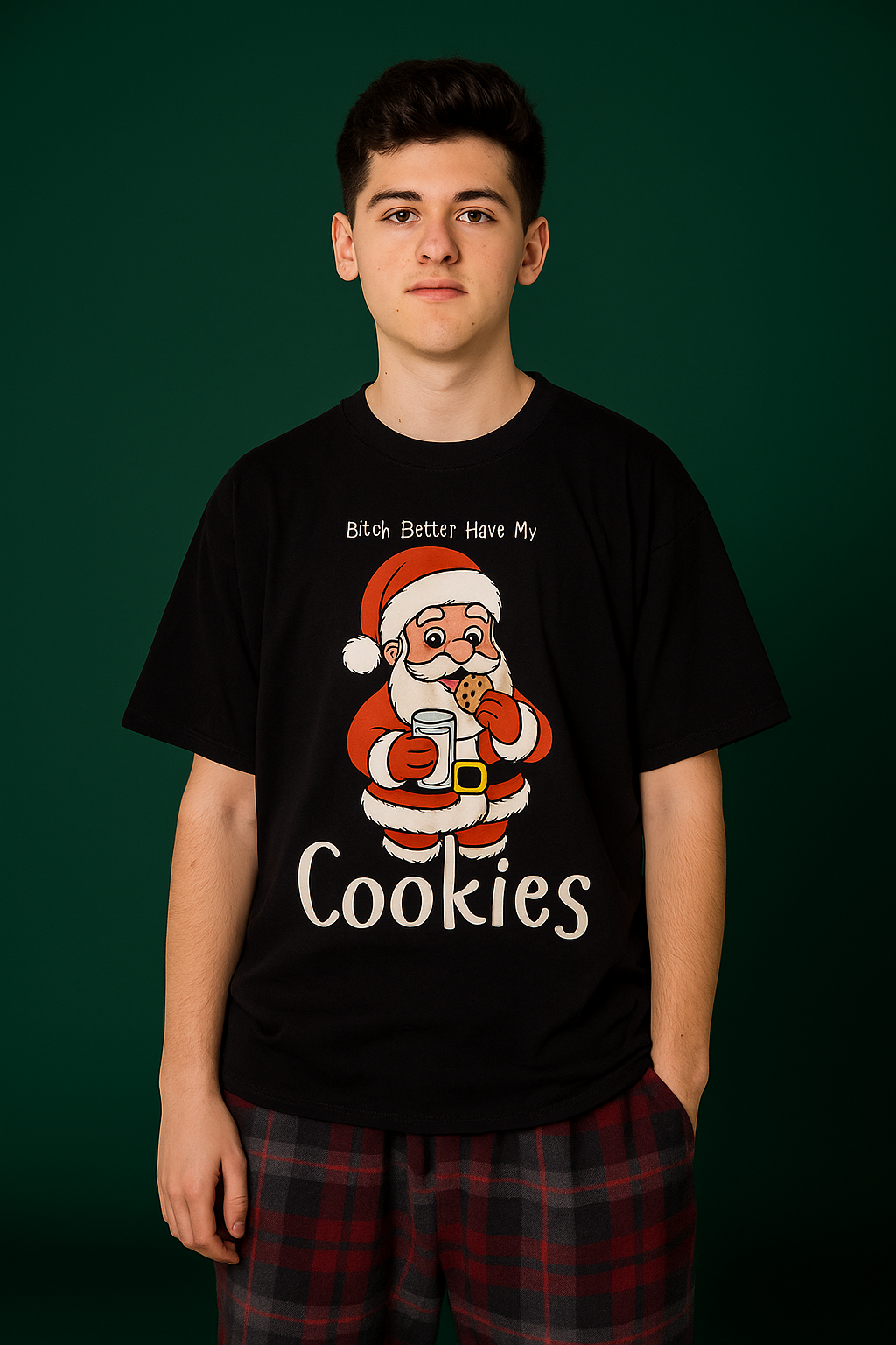 young man wearing a black tee shirt with Santa eating a cookie and the text "Bitch better have my cookies"