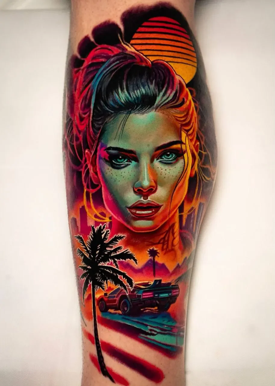 Colorful tattoo featuring a woman with dreadlocks and vibrant makeup, a sunset with a palm tree, and a sports car on a road.