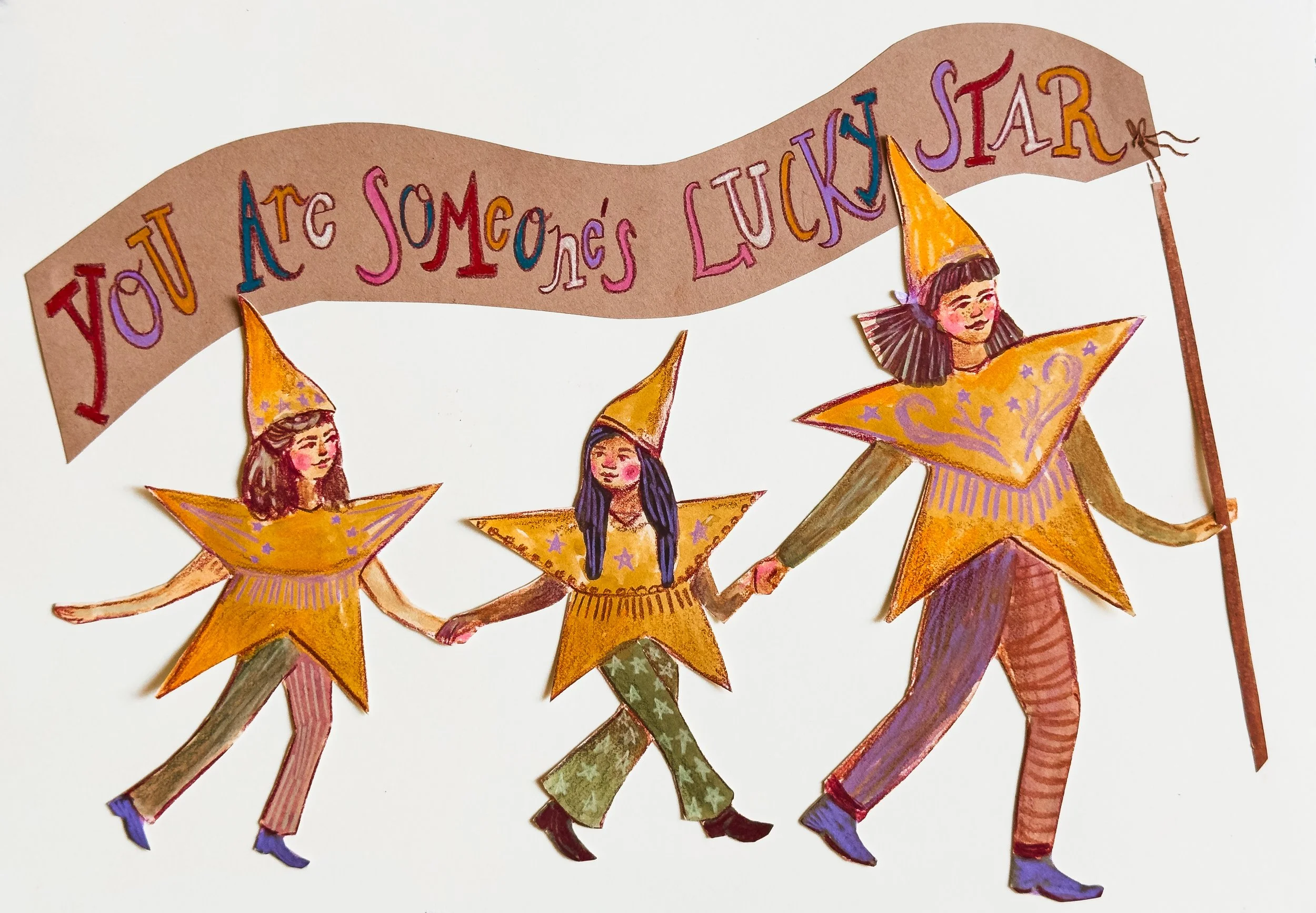 Colorful collage illustration of three girls dressed as stars, holding hands as they walk. Each girl wears a large yellow star costume with painted details and a matching cone hat. Above them is a pink and purple banner with the words 'You Are Someon