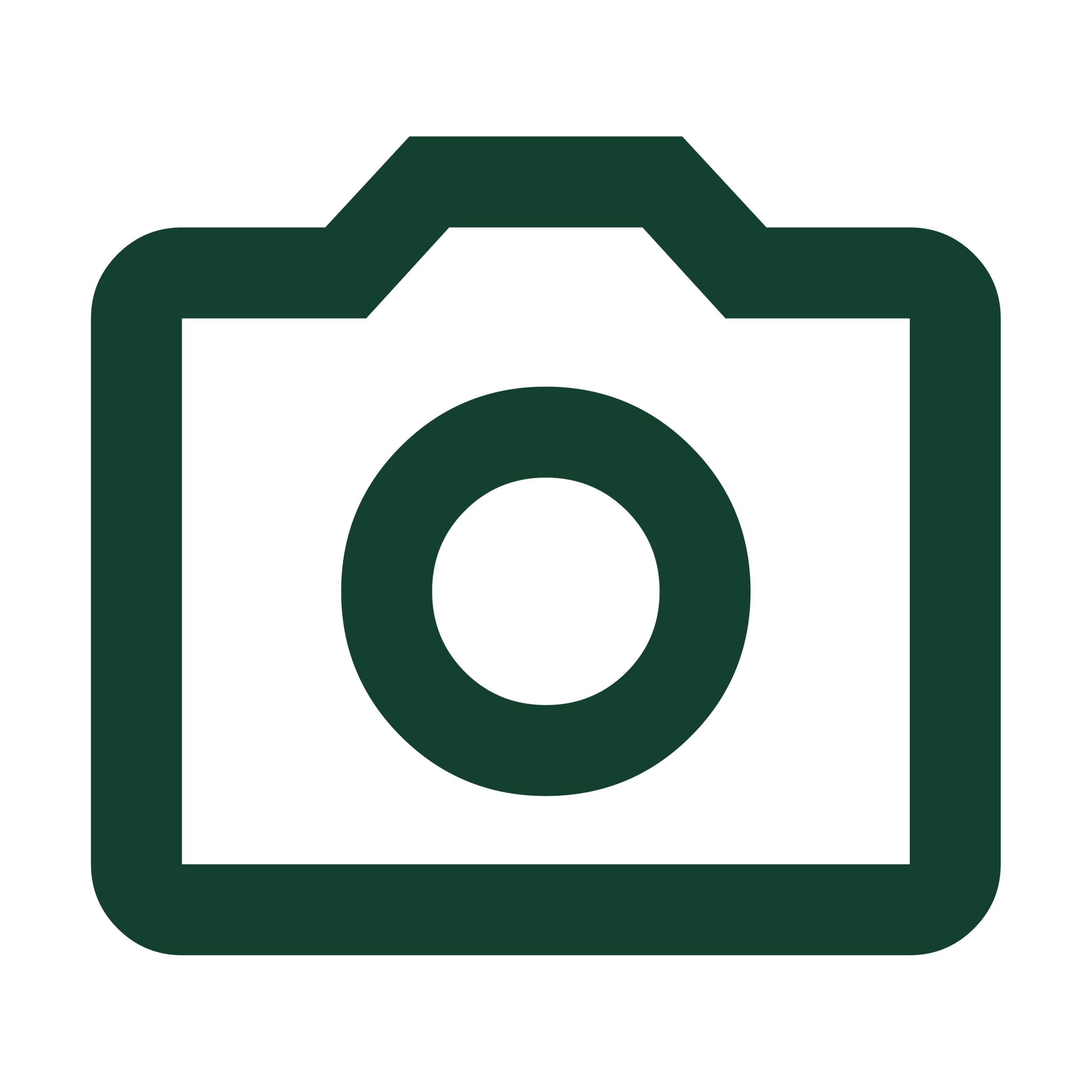 Green icon of a camera with a circular lens in the center on a white background.