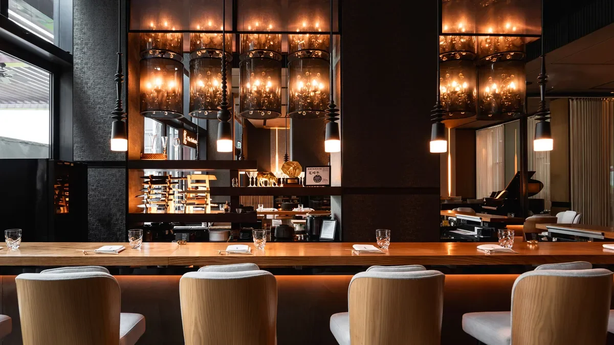 Interior of a modern restaurant or bar with a long wooden counter