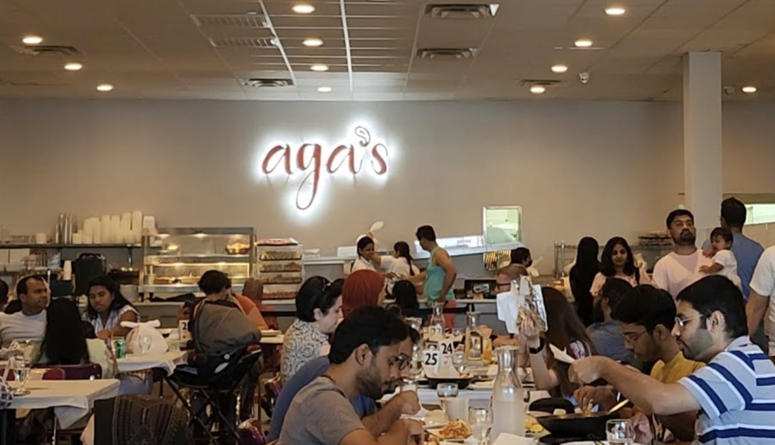 People dining in one of the many dining rooms at Aga's restaurant.