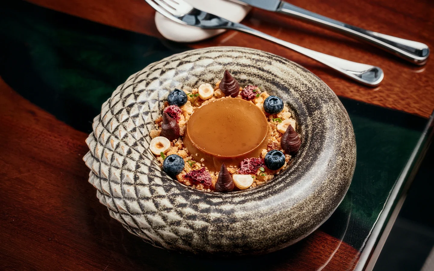 Chocolate dessert with blueberries, and hazelnuts