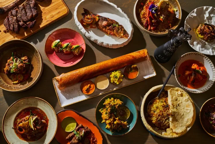 A variety of Indian dishes laid out on a table.