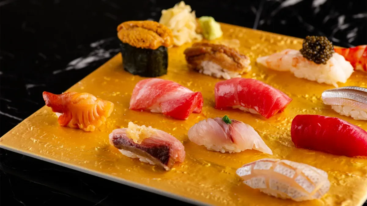 Assorted sushi pieces, including tuna, salmon, eel, shrimp, and fish roe.