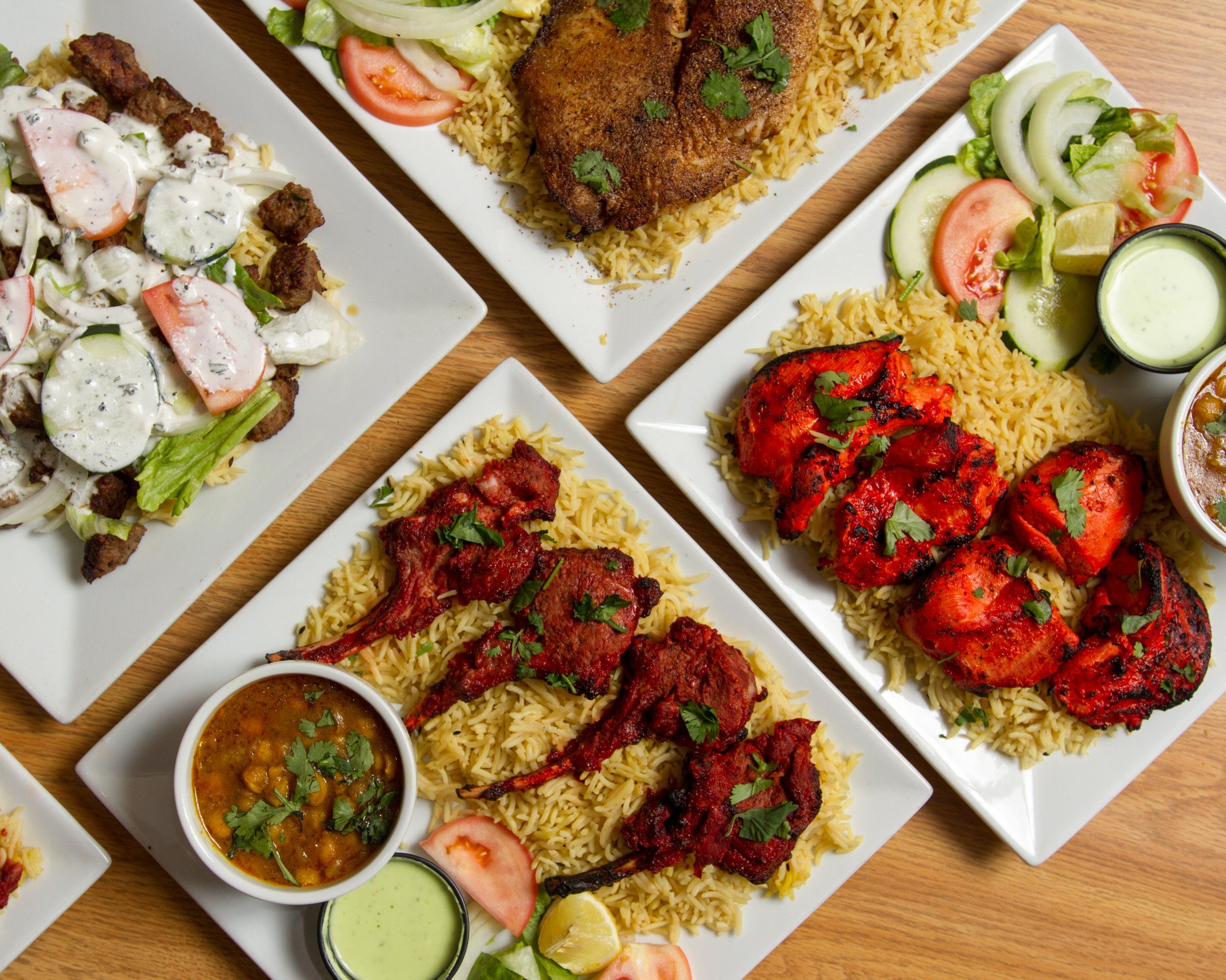 Assorted dishes of Indian cuisine including chicken tandoori