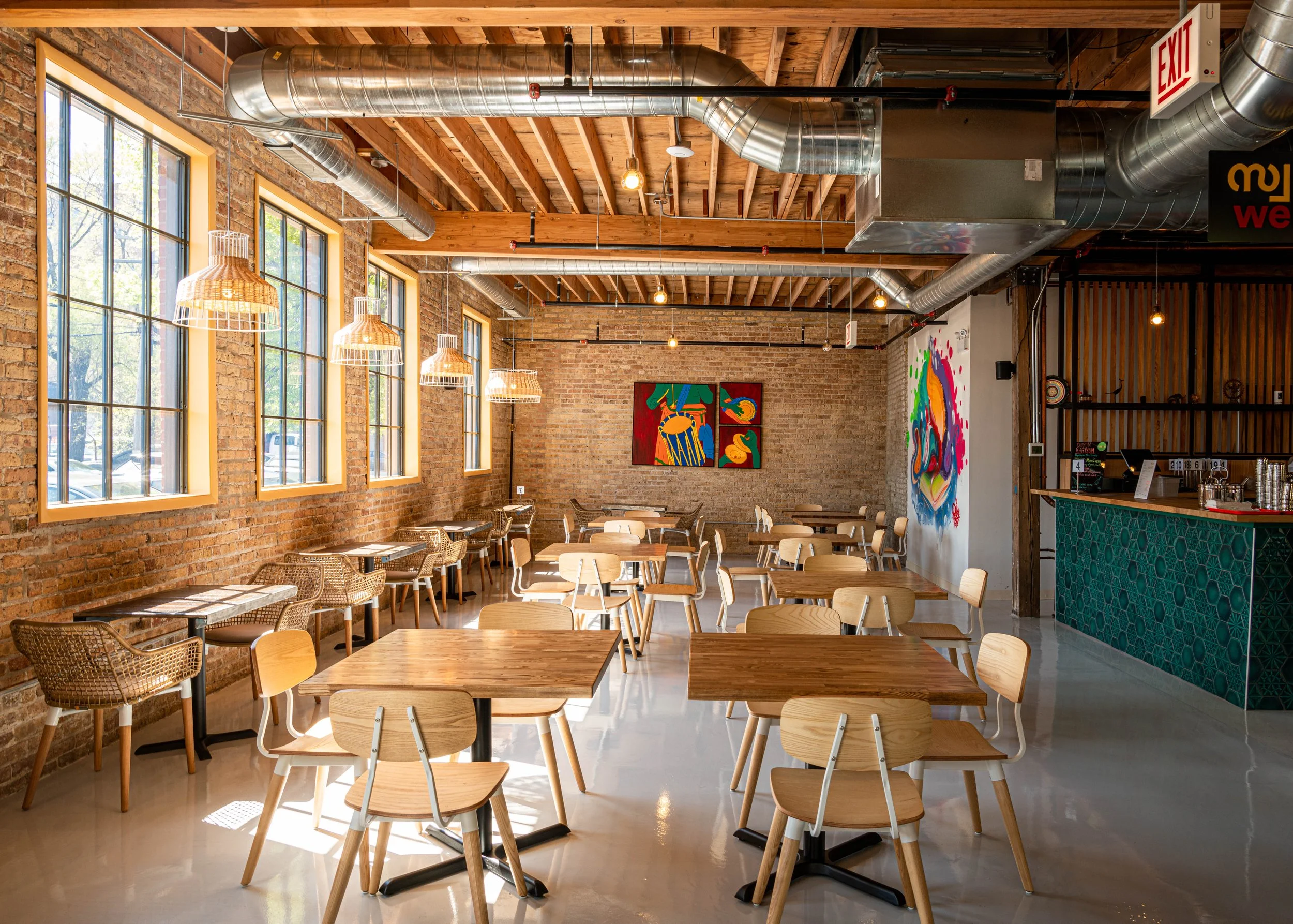 Interior of a modern restaurant with wooden tables