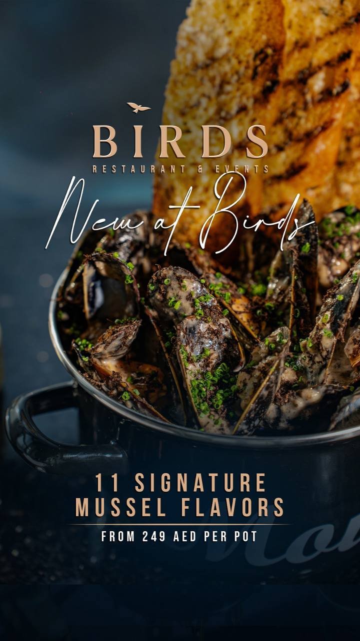 A promotional image for a restaurant called Birds, featuring a bowl of cooked mussels