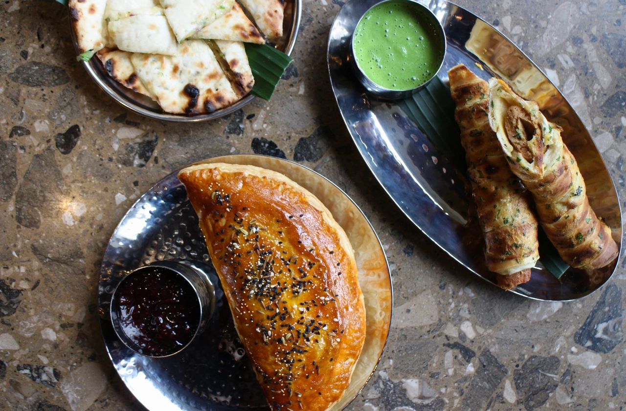 Indian dishes including naan bread, spring rolls with dipping sauce