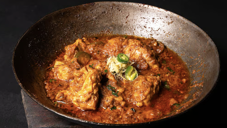 desi food reviews - chicken karahi served in a black iron wok in houston