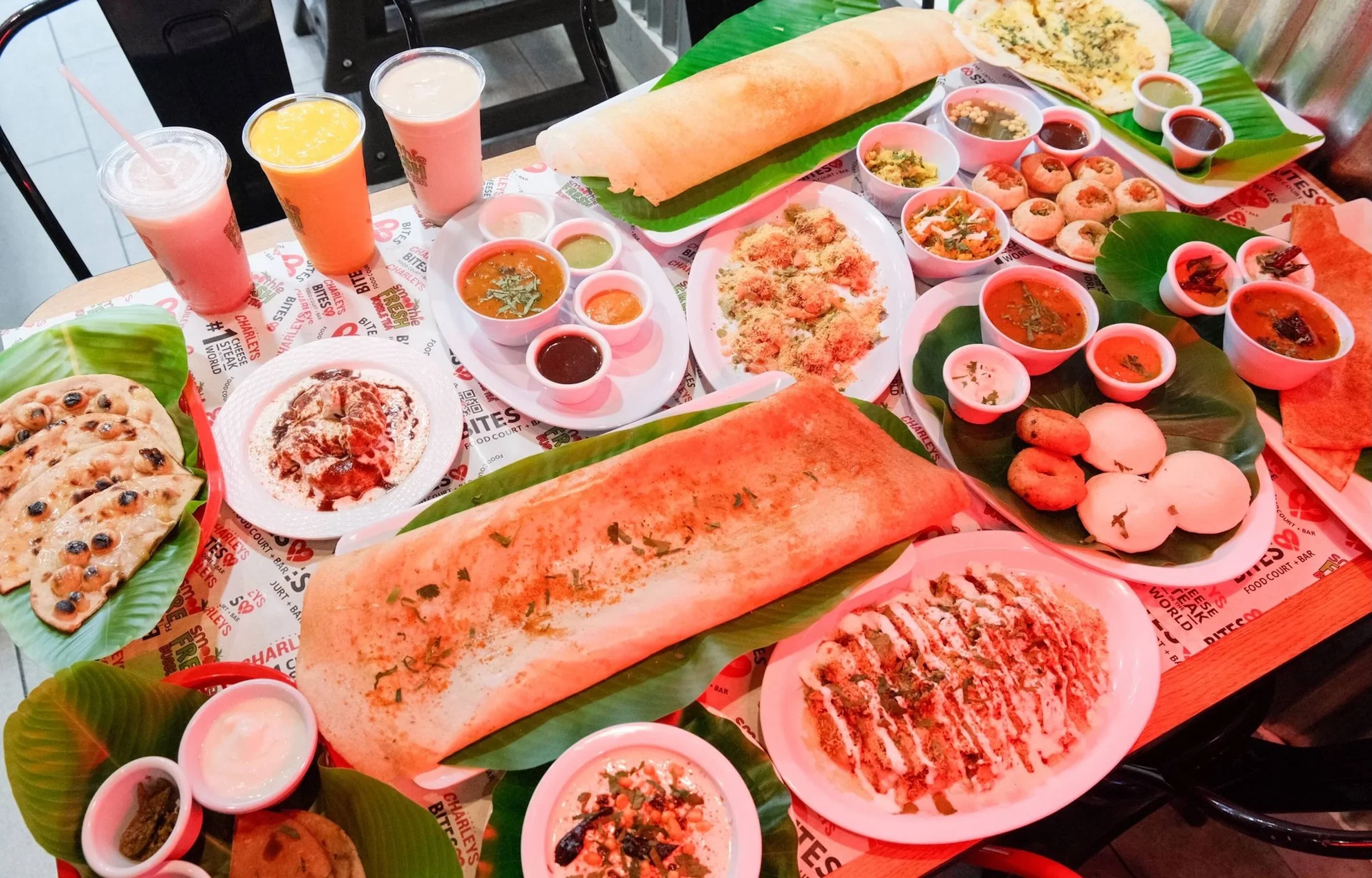 A spread of various Indian foods on a table