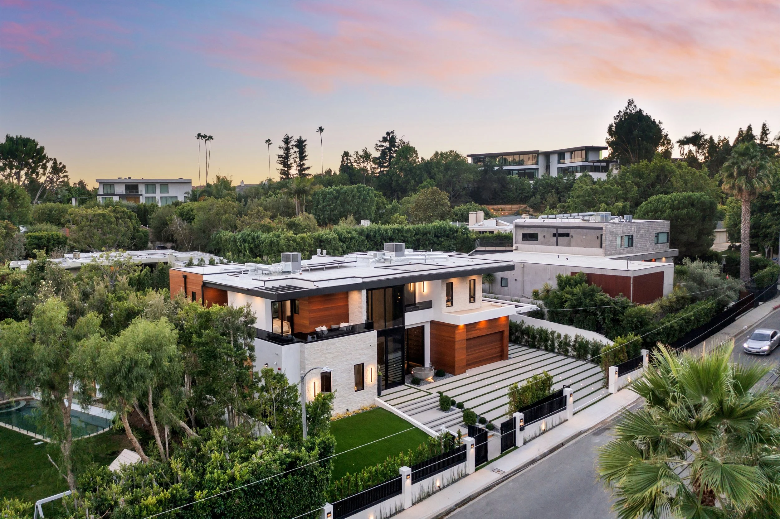 modern-luxury-house-aerial-view-at-sunset-2025-02-10-06-40-21-utc.jpg