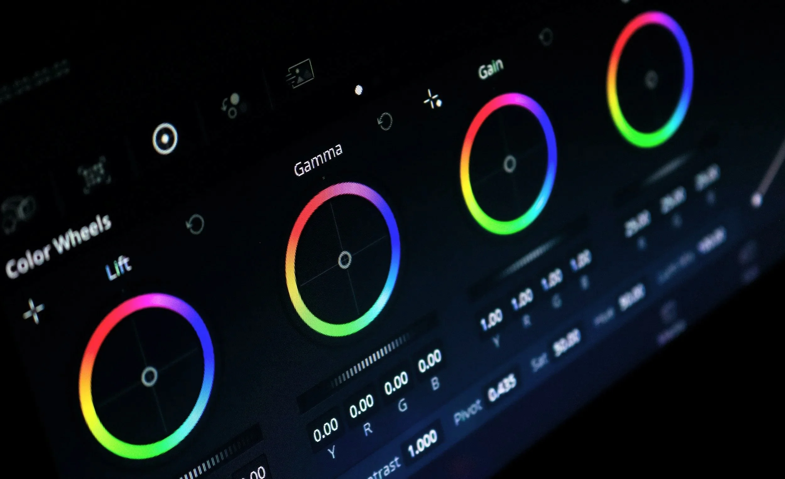 Screenshot of color grading software with rainbow color wheels labeled 'Color Wheels,' 'Gamma,' and 'Gain'.
