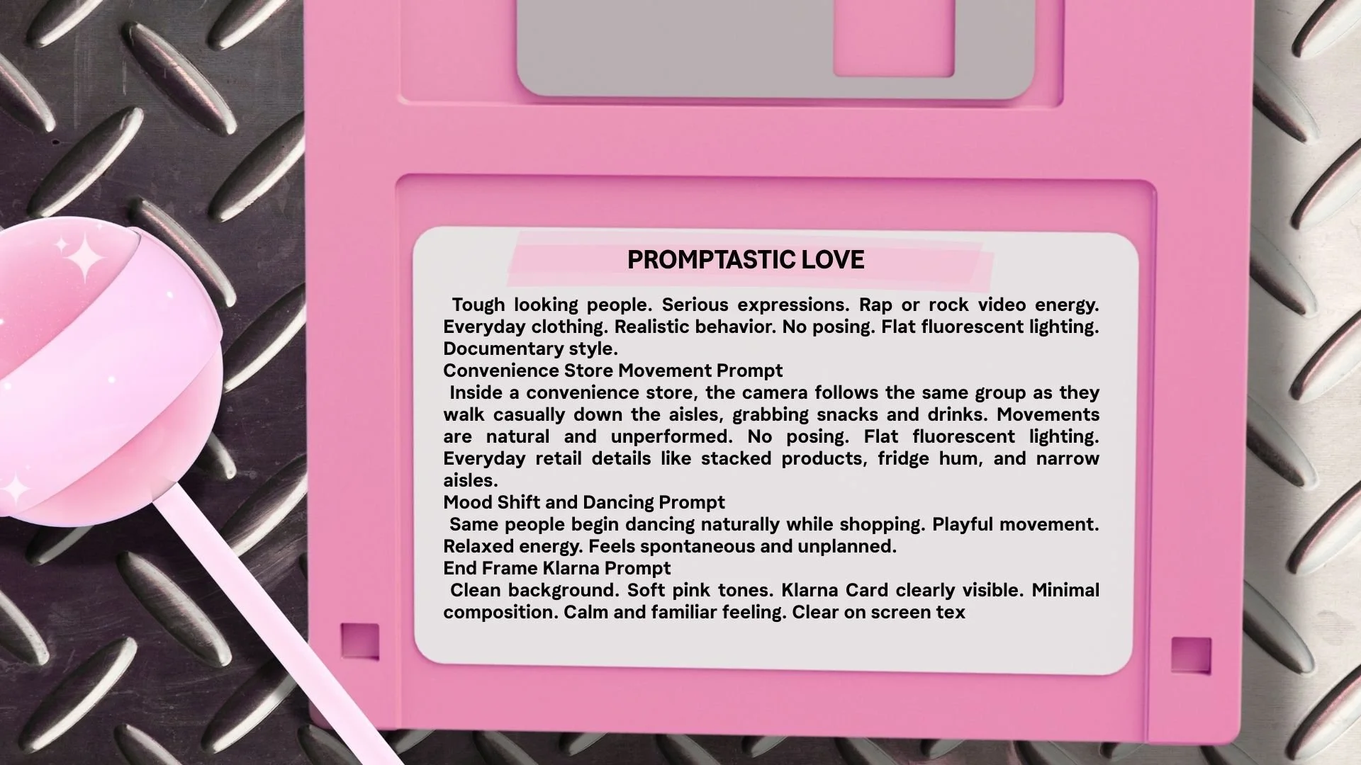 A pink CD case with a white label containing text, placed on a metal surface with a pink lollipop on the left side.