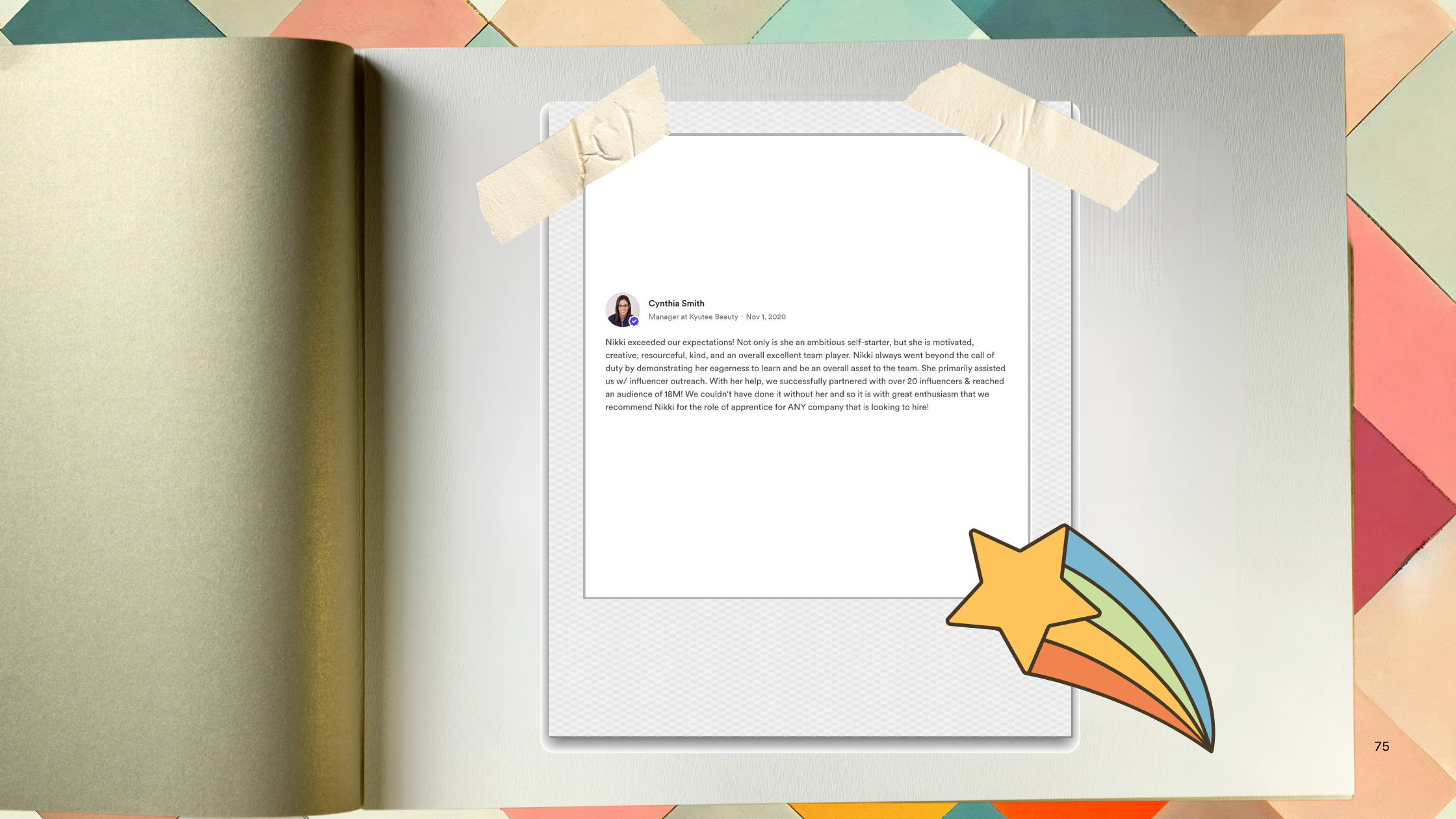 Open notebook with a printed review on a digital screen taped to the page. A colorful shooting star sticker is in the bottom right corner of the page, and multi-colored paper covers the table behind. The review praises a person named Nikki for her contributions and qualities, mentioning her as a self-starter with a positive impact on the team.