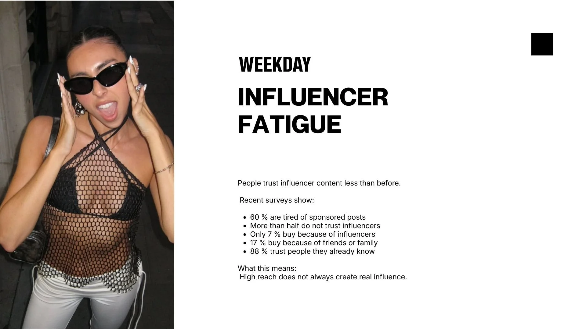 A woman wearing black sunglasses, a black mesh top, and white pants, holding her face with her hands, posing for a photo.