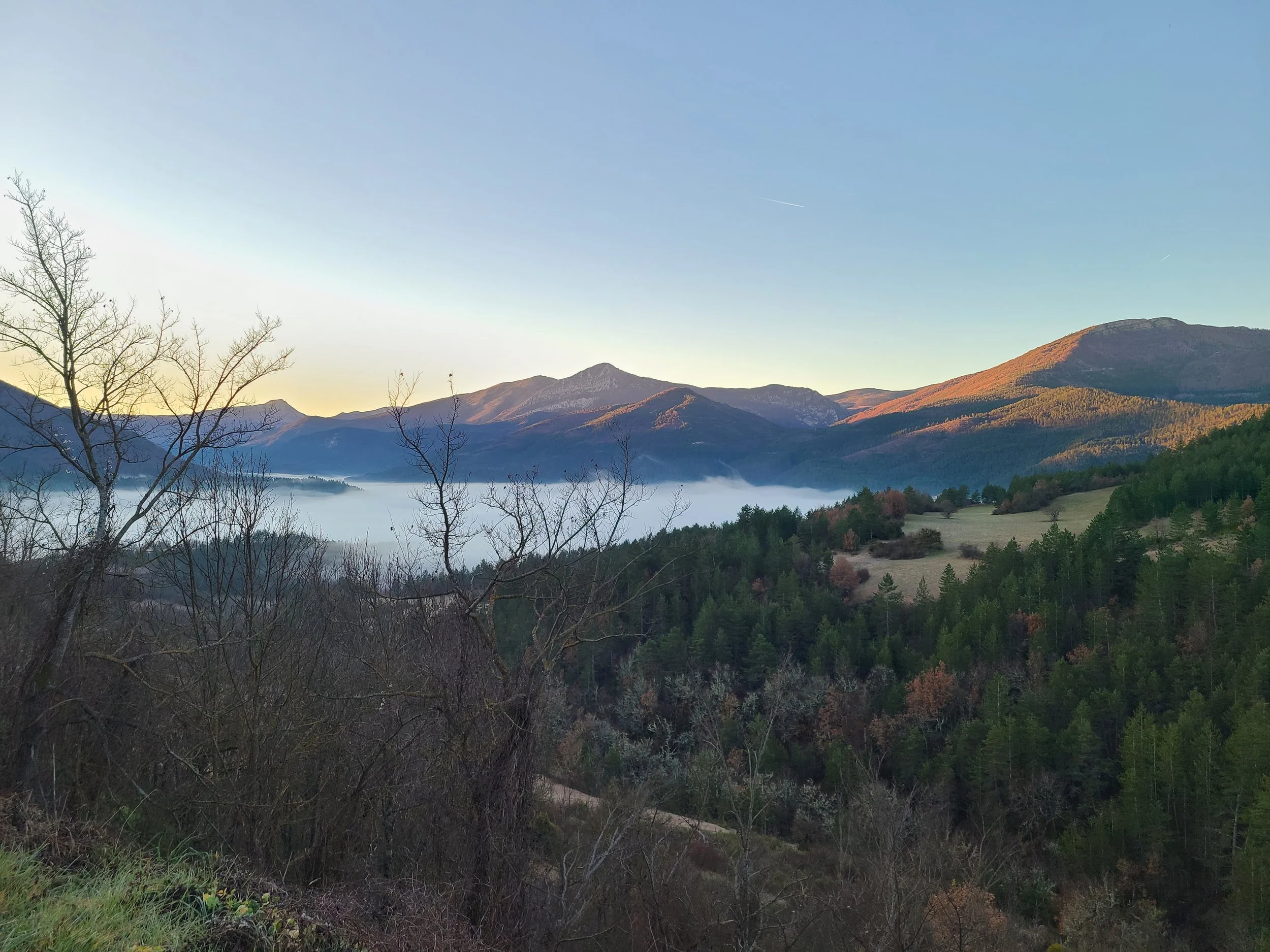 View from my grandparents' village in the early morning with the clouds are hanging low.