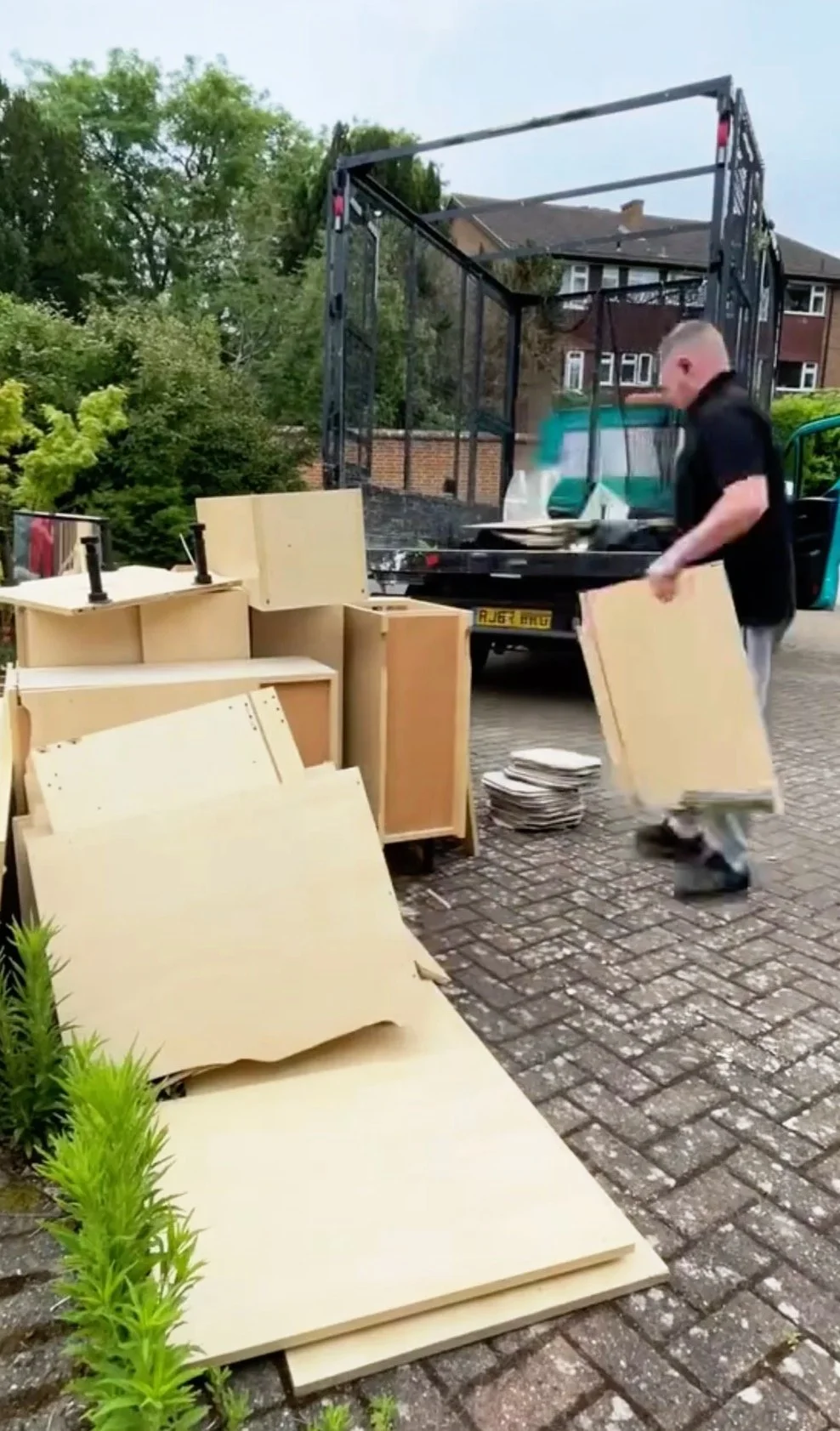 Crew performing wait-and-load outside commercial premises, South-West London