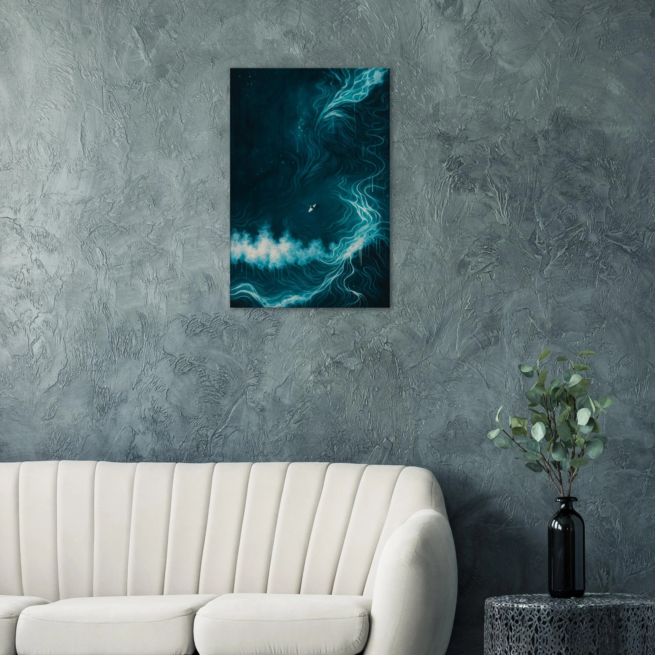 Modern living room corner with textured gray wall, abstract blue artwork hanging above a white sofa, and a black vase with green foliage on a decorative side table.