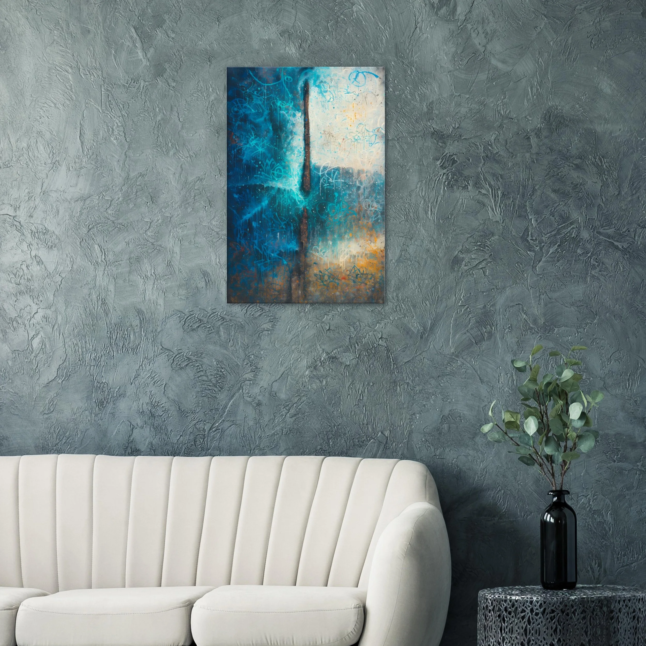 Living room with textured gray wall, white sofa, black vase with green leafy plant, and abstract painting with blue, white, orange, and gray colors.