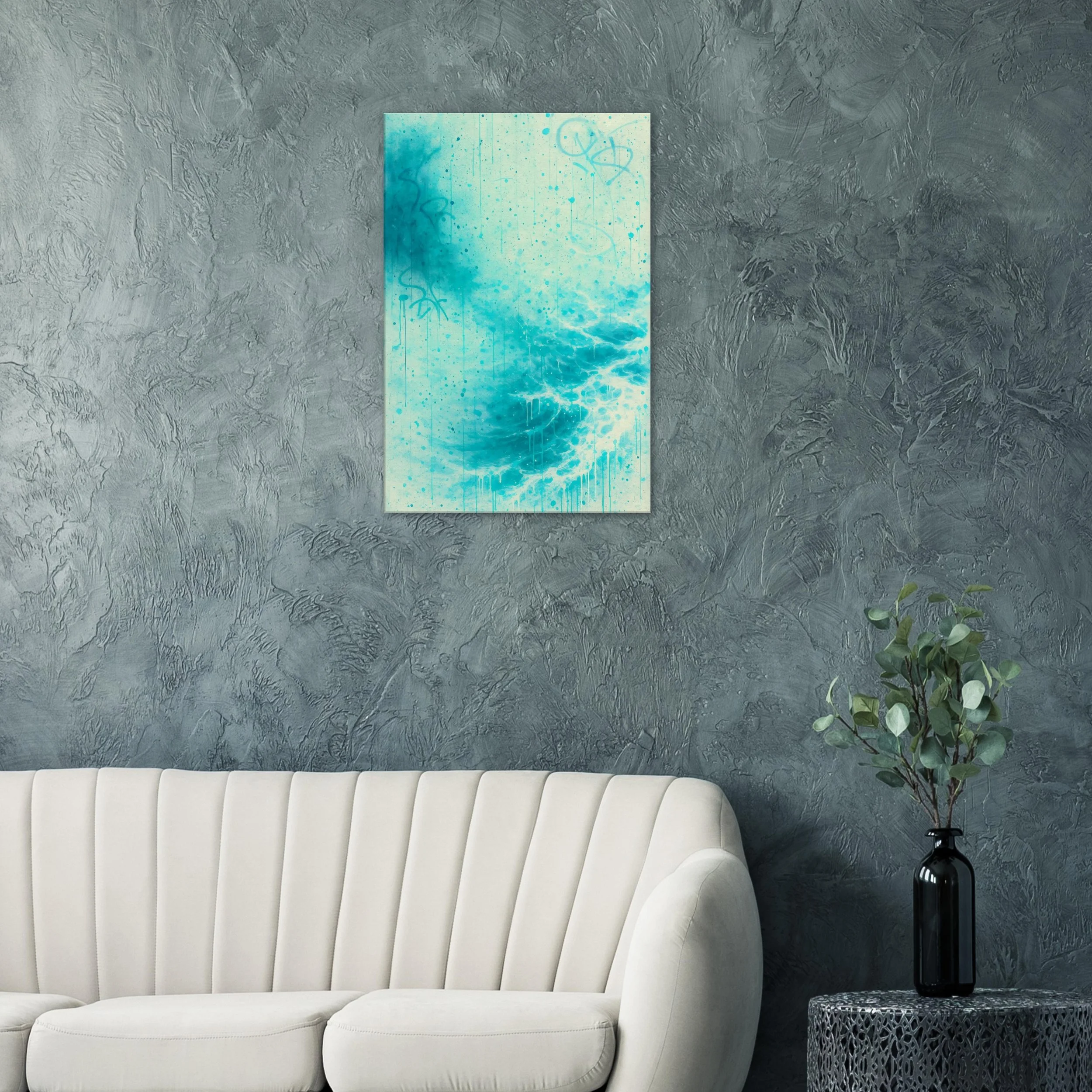Living room with textured gray wall, beige sofa, abstract blue and white artwork, and black vase with green leafy plant on black table.