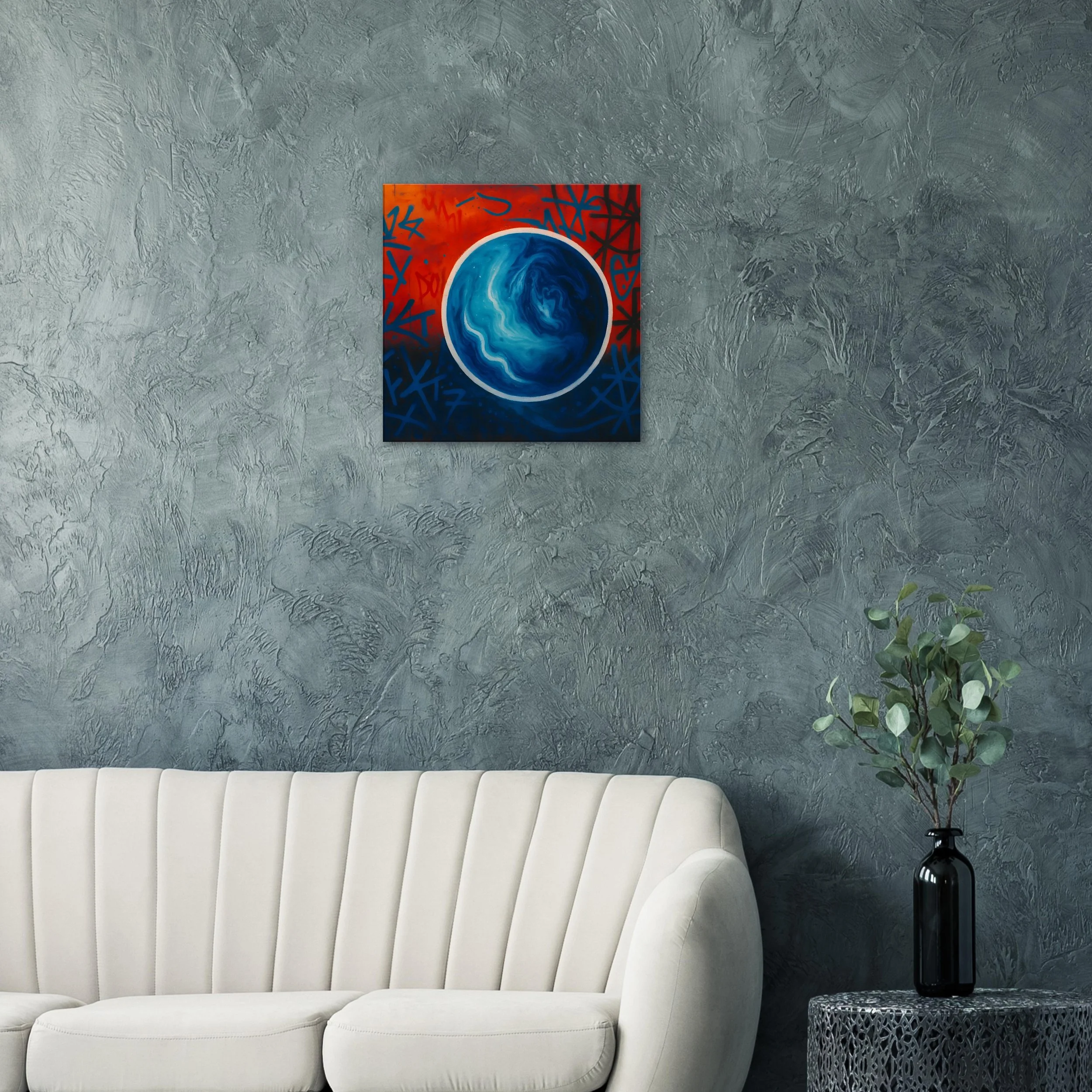 Modern living room with a textured gray wall, white sofa, and abstract art featuring a blue and white swirling circle on a red and dark background, with a black vase and green plant on a side table.