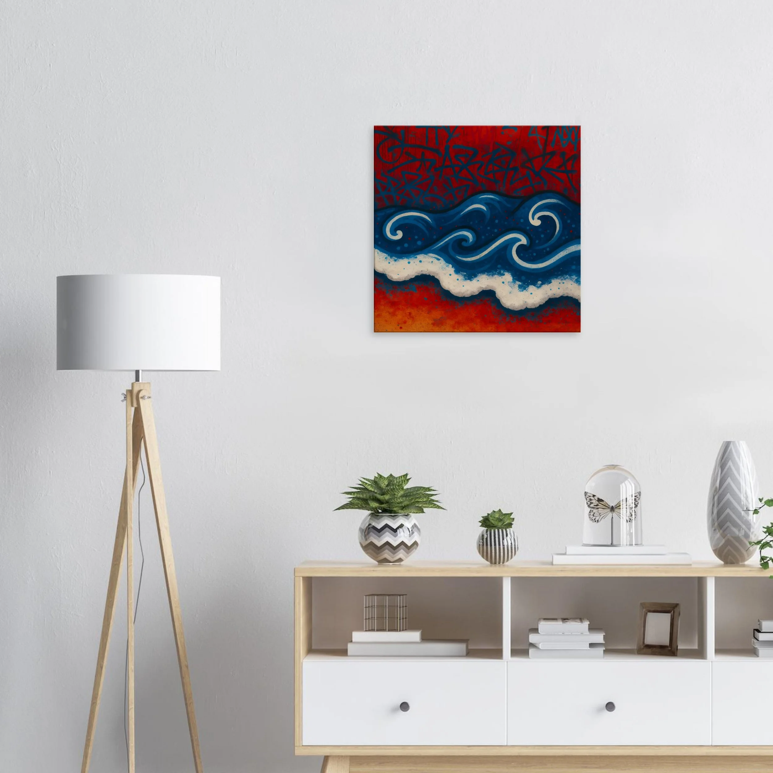 Minimalist interior with a colorful abstract painting of waves on the wall, a white floor lamp, and a wooden console table with potted plants, books, and decorative items.