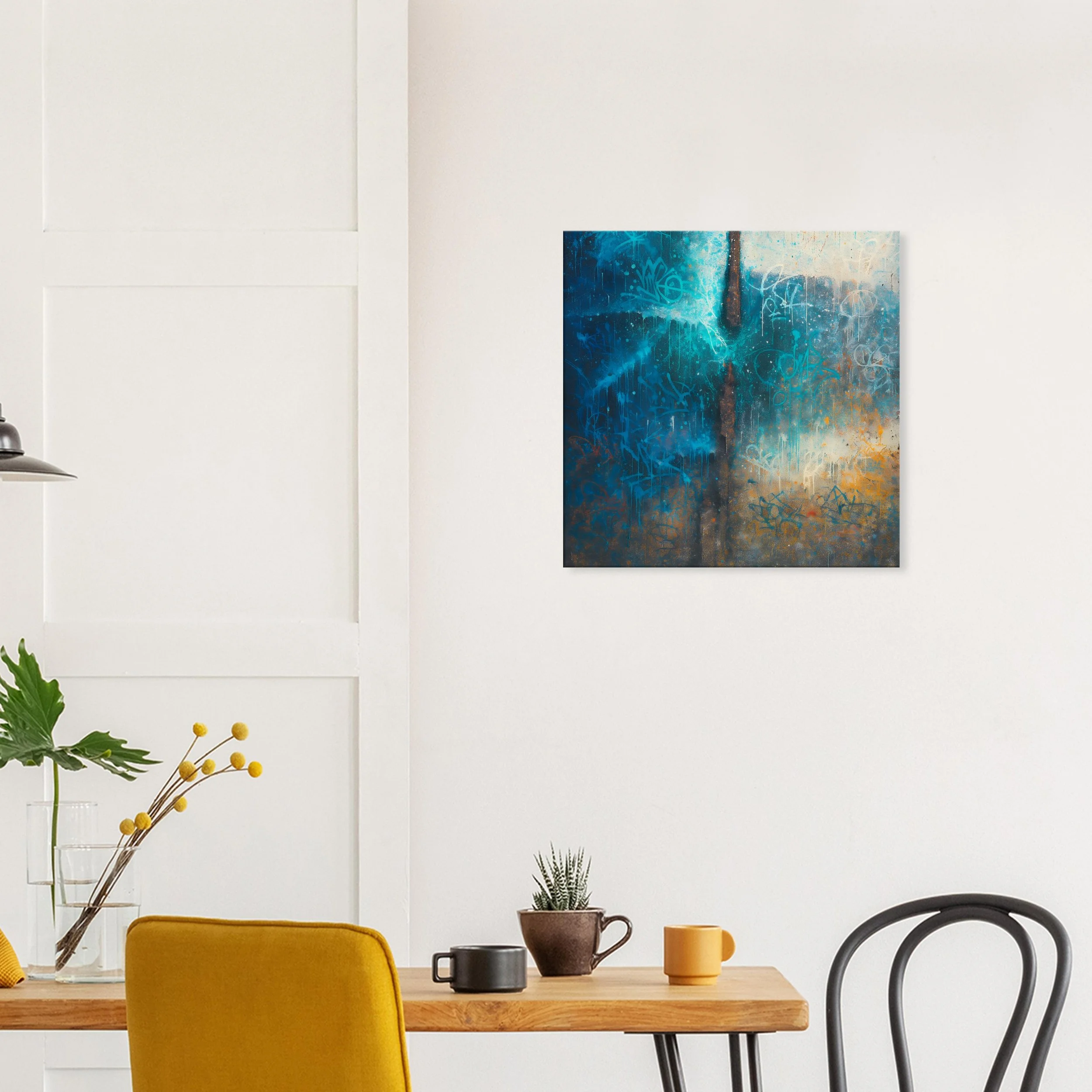 Contemporary interior with a white wall, colorful abstract painting, wooden table, yellow chair, and decorative plants.