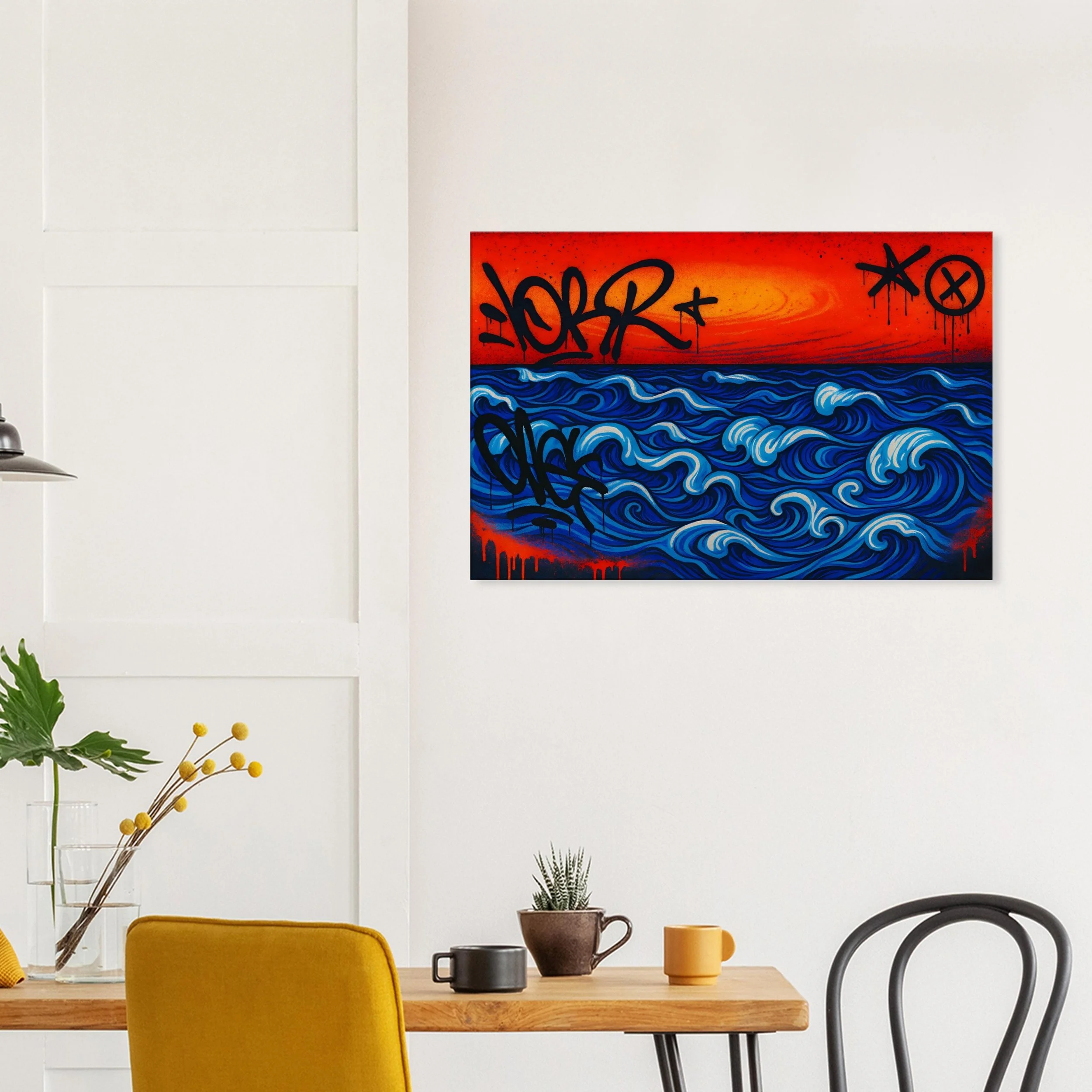 Modern interior with a white wall decorated with a vibrant graffiti-style artwork of blue ocean waves against a red and orange sunset background, with black graffiti tags.