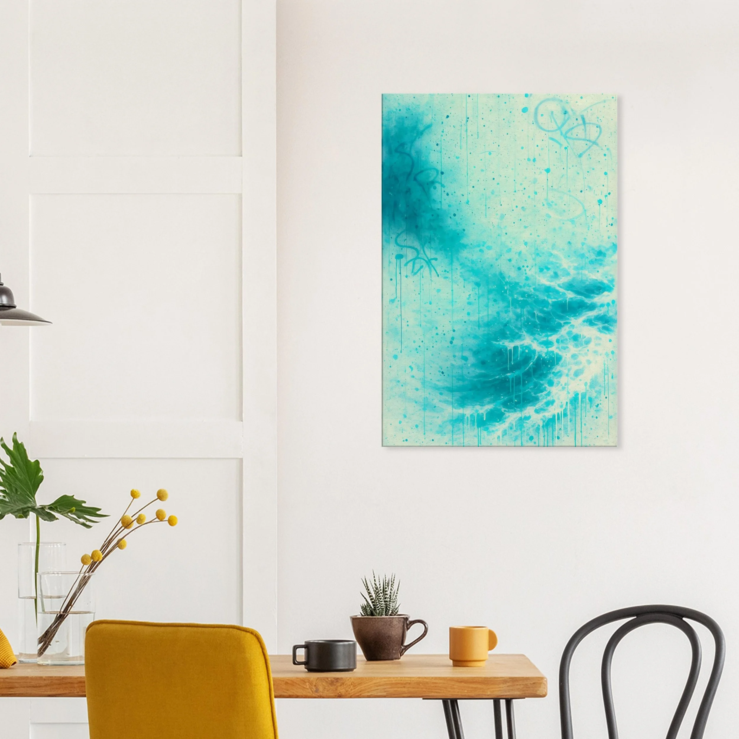 Modern dining area with a wooden table, yellow chair, black and yellow mugs, potted plant, and a large abstract turquoise artwork on white wall.