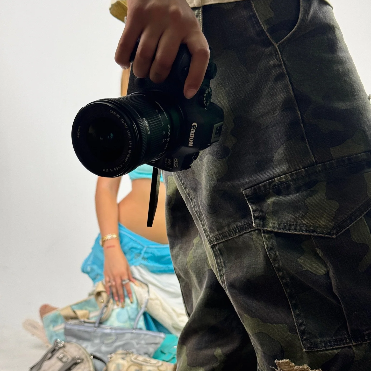 Photograph of a person taking a photoshoot for Dainty Vintage's latest Coach Bag release.